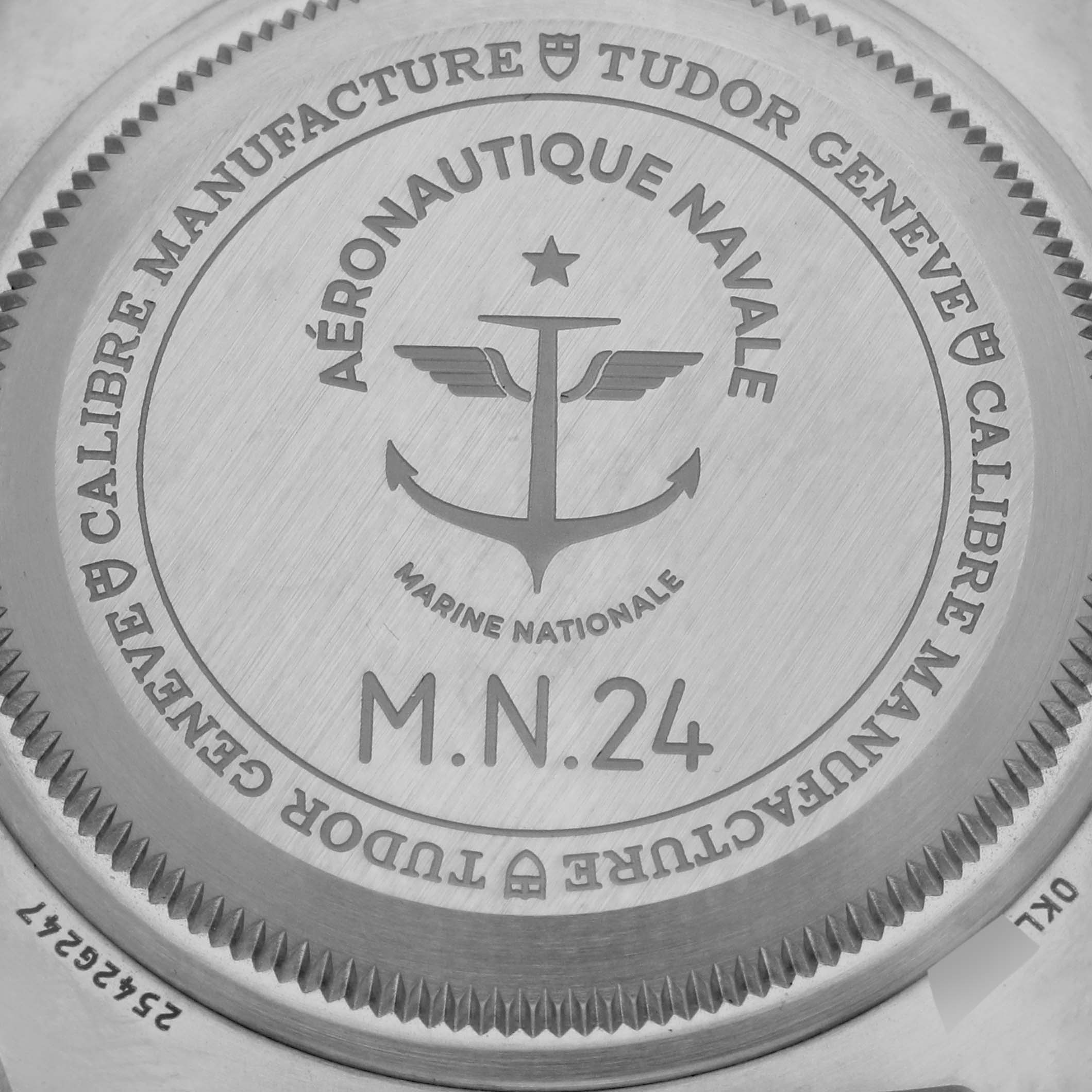 The image shows the engraved case back of the Tudor Pelagos 2542G247NU-0001 Men
s Titanium Black Dial 2542G247NU-0001 Men
s Titanium Black Dial watch, focusing on the collaborative Marine Nationale details.