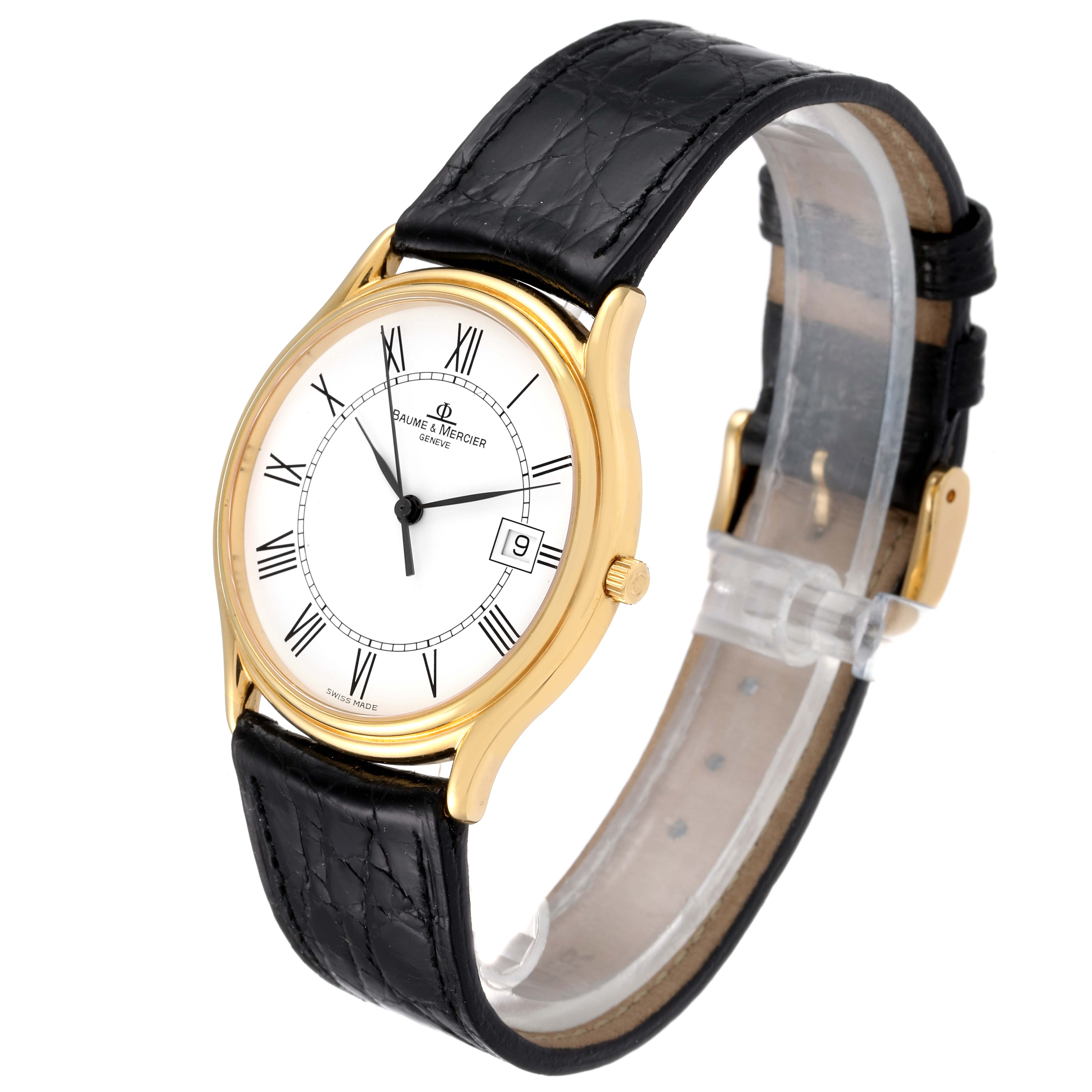The image shows a Baume & Mercier Classima MV045236 Men's Yellow Gold White Dial MV045236 Men's Yellow Gold White Dial watch at a 3/4 angle, highlighting the black leather strap, white dial, and gold case.