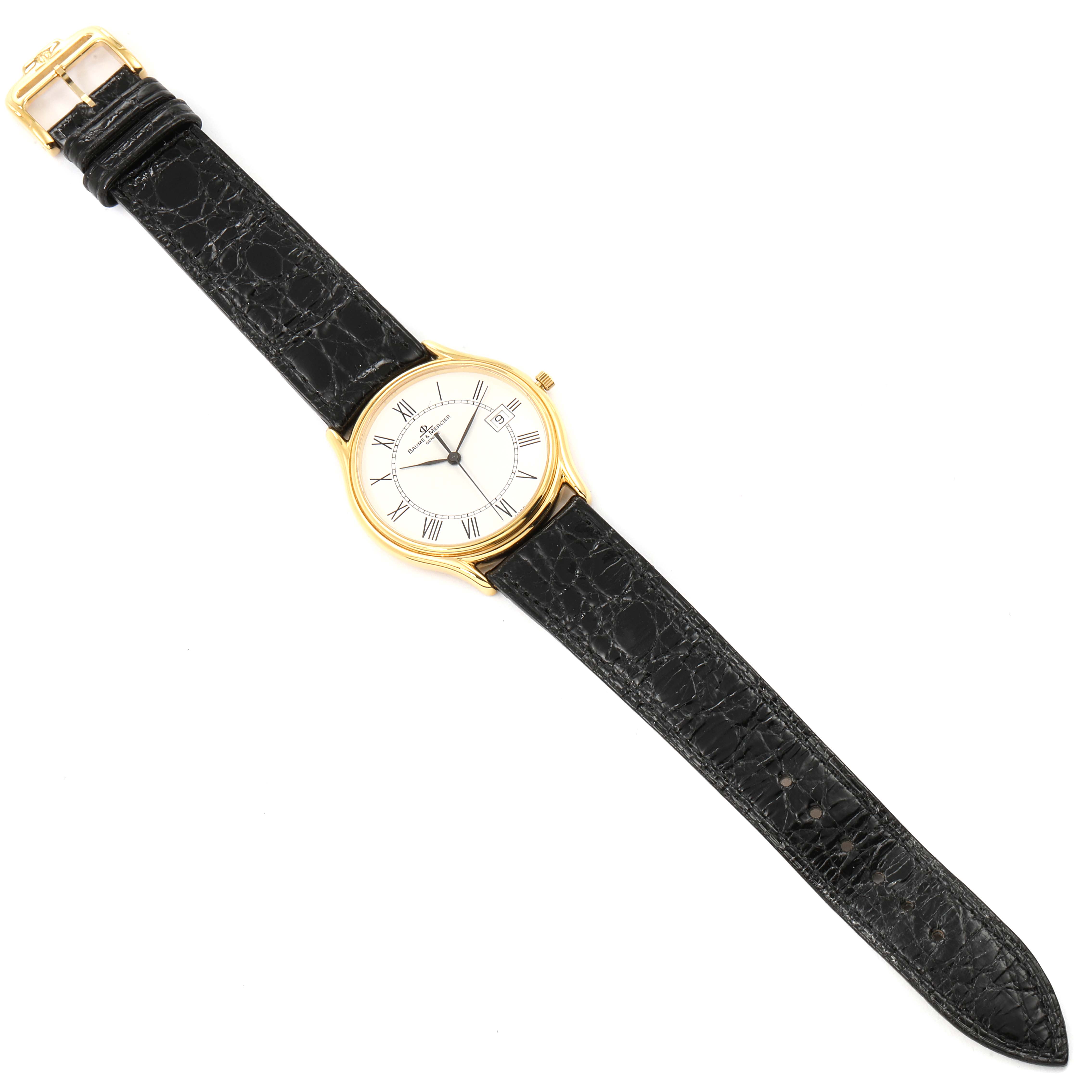 The image shows a Baume & Mercier Classima MV045236 Men's Yellow Gold White Dial MV045236 Men's Yellow Gold White Dial watch from a top-down angle, including the black leather strap and gold bezel.