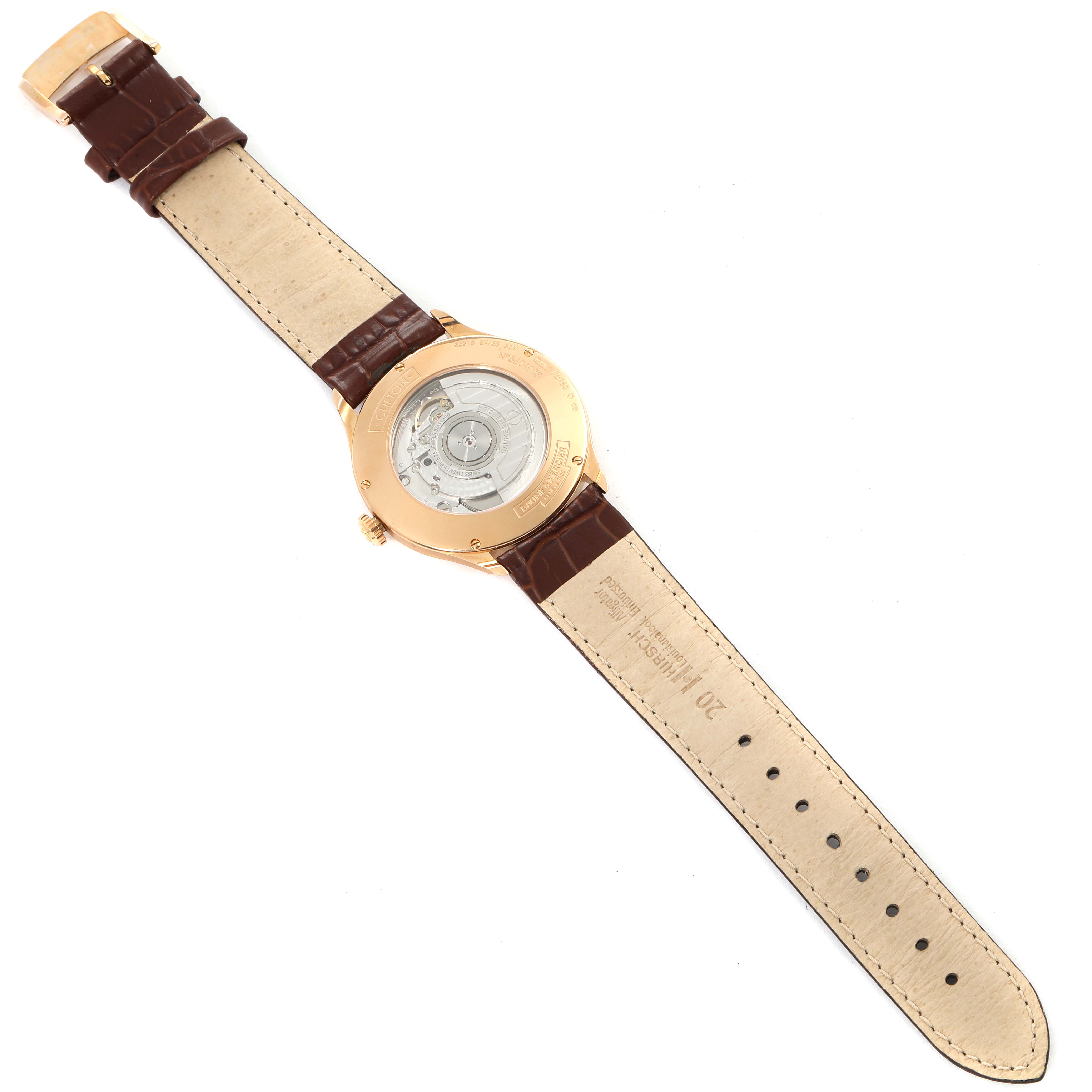 The image shows the back view of a Baume & Mercier Clifton M0A10059 Men's Rose Gold Grey Dial M0A10059 Men's Rose Gold Grey Dial model watch, revealing the inner mechanism and brown leather strap.