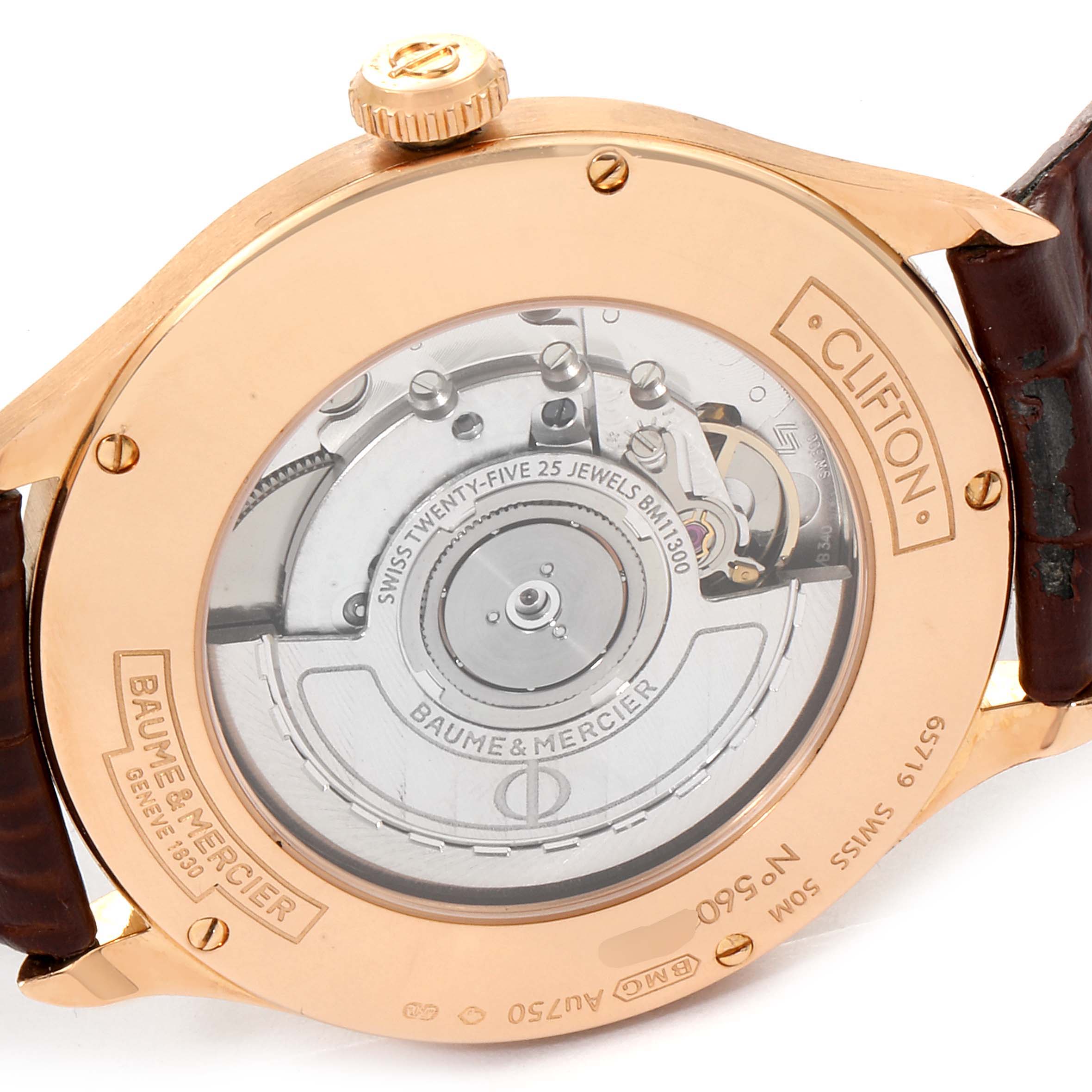 This image shows the back view of the Baume & Mercier Clifton M0A10059 Men's Rose Gold Grey Dial M0A10059 Men's Rose Gold Grey Dial watch, highlighting the movement and engraving details.