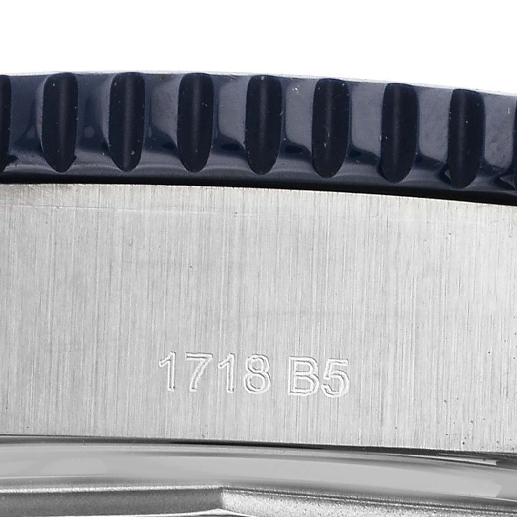 The image shows a close-up view of the Breitling Superocean Y1739316/C959 Men's Stainless Steel Blue Dial Y1739316/C959 Men's Stainless Steel Blue Dial watch case with the bezel and a part number engraved.
