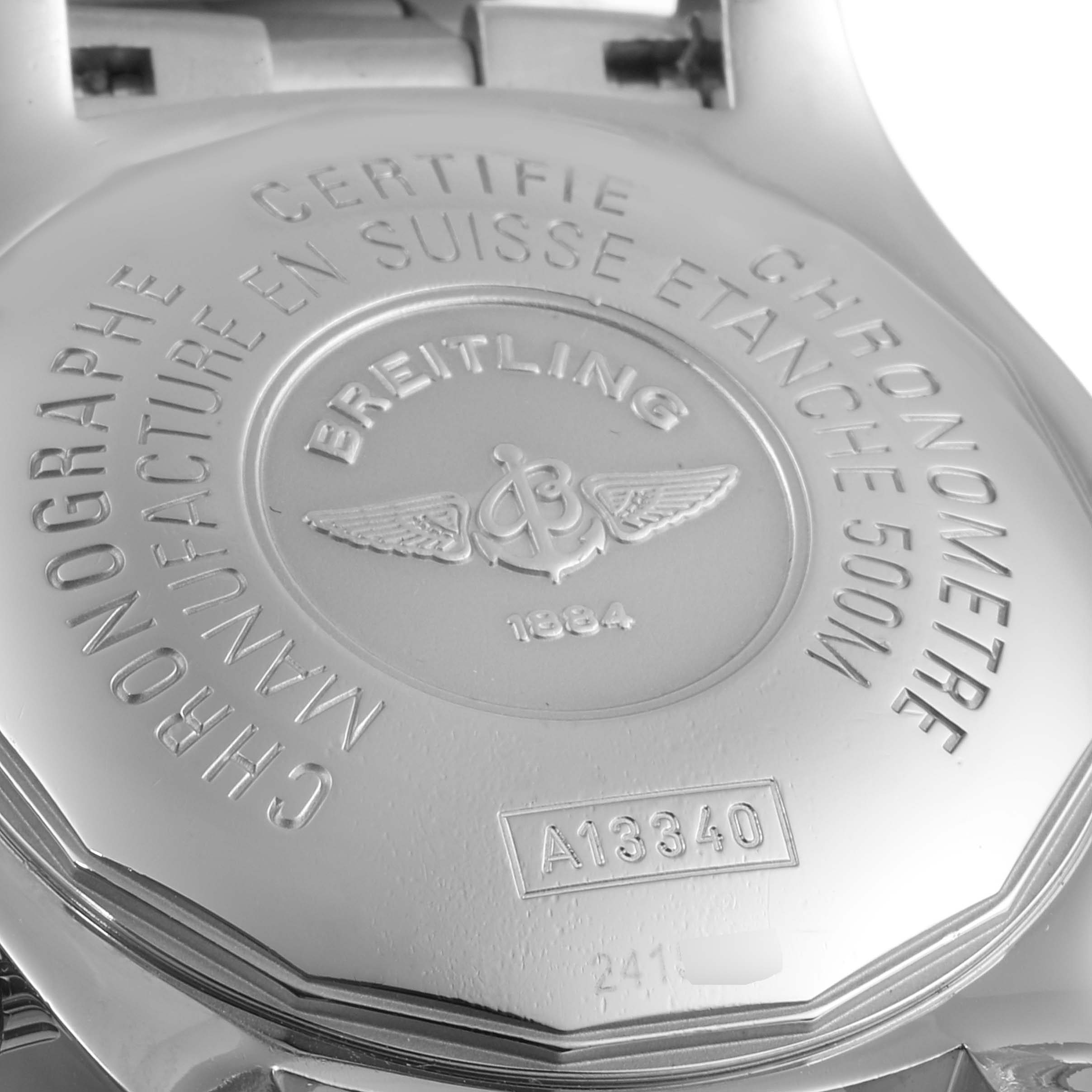 The image shows the back case of a Breitling Superocean A13340 Men
s Stainless Steel Blue Dial A13340 Men
s Stainless Steel Blue Dial watch, highlighting its certification and model number.