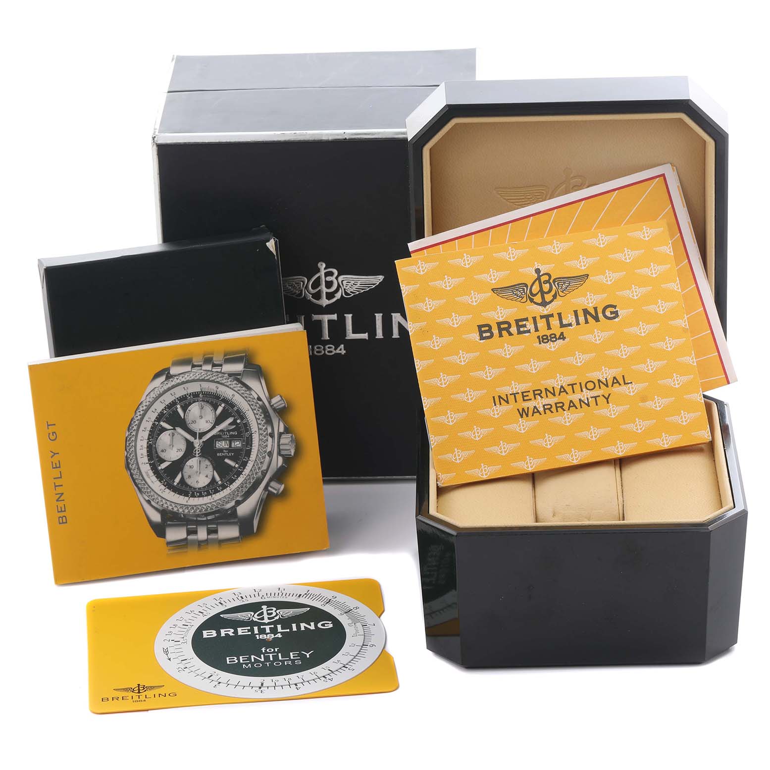 The image shows the Breitling Bentley A1336212/L503-SS Men's Stainless Steel Green Dial A1336212/L503-SS Men's Stainless Steel Green Dial watch model’s box, warranty card, and manual from an angled top view.