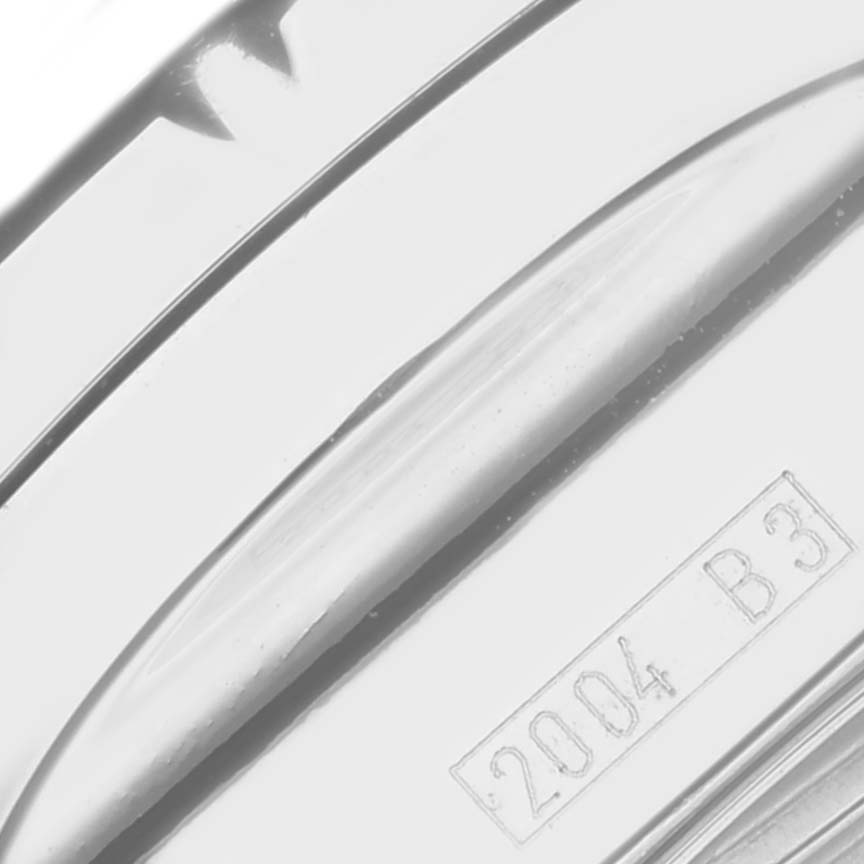 The image shows a close-up of the side of a Breitling Bentley A1336212/L503-SS Men's Stainless Steel Green Dial A1336212/L503-SS Men's Stainless Steel Green Dial watch, highlighting its polished metal surface and engraved details.