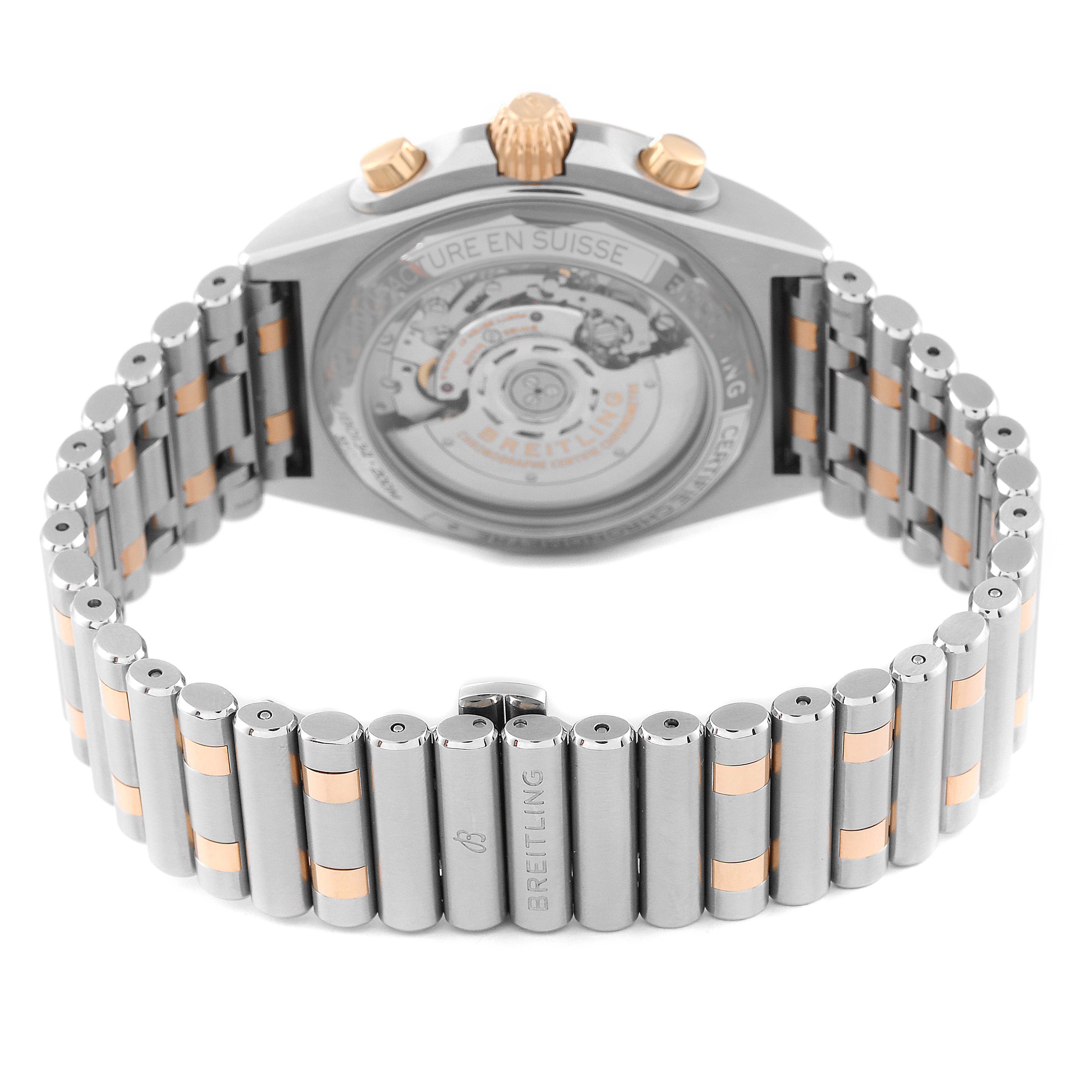 The image shows the back view of a Breitling Chronomat UB0134 Men's Steel and Gold (two tone) Grey Dial UB0134 Men's Steel and Gold (two tone) Grey Dial watch, highlighting the intricate movement and the metal bracelet.