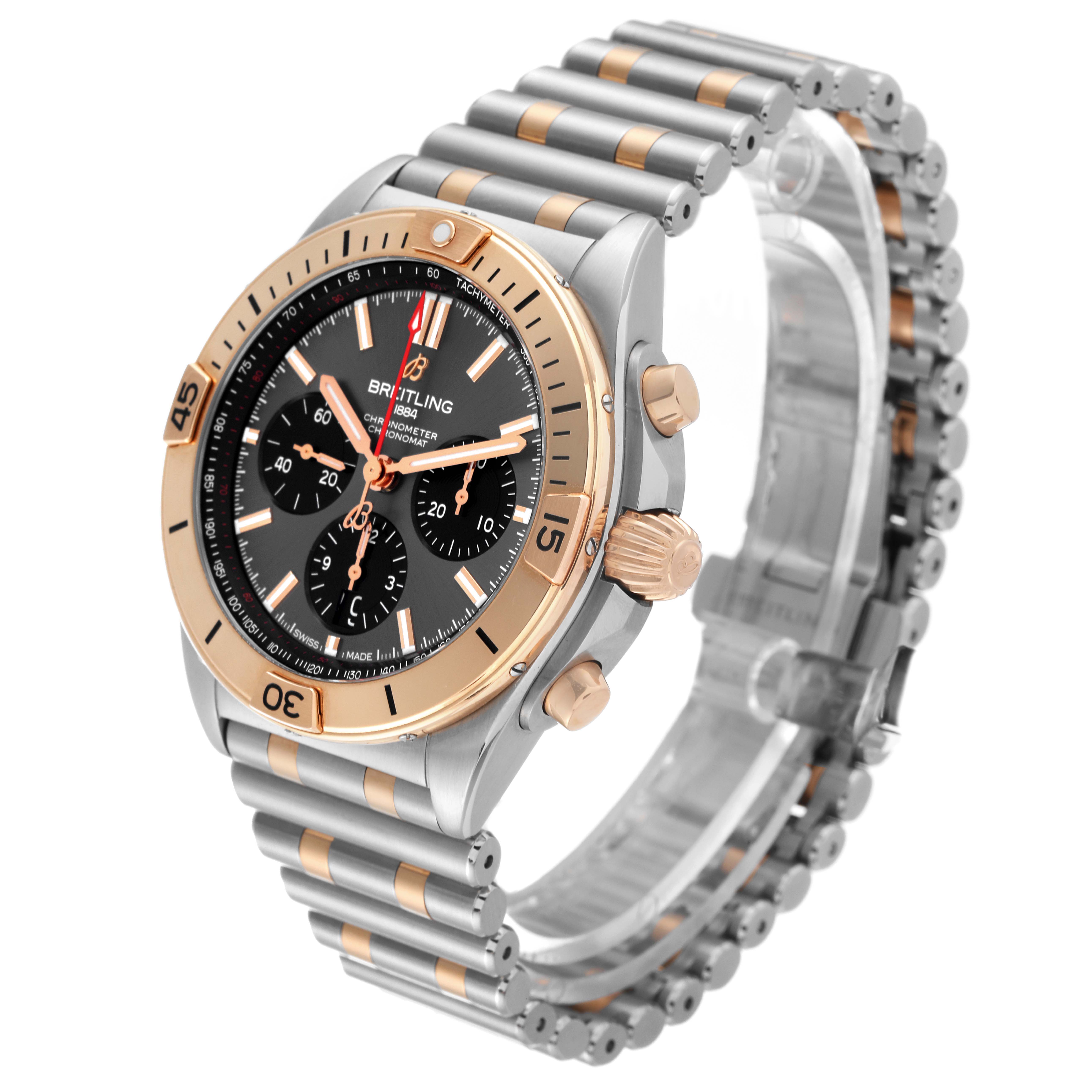 This Breitling Chronomat UB0134 Men's Steel and Gold (two tone) Grey Dial UB0134 Men's Steel and Gold (two tone) Grey Dial watch is shown from a three-quarter angle, highlighting the bezel, crown, chronograph subdials, and bracelet.