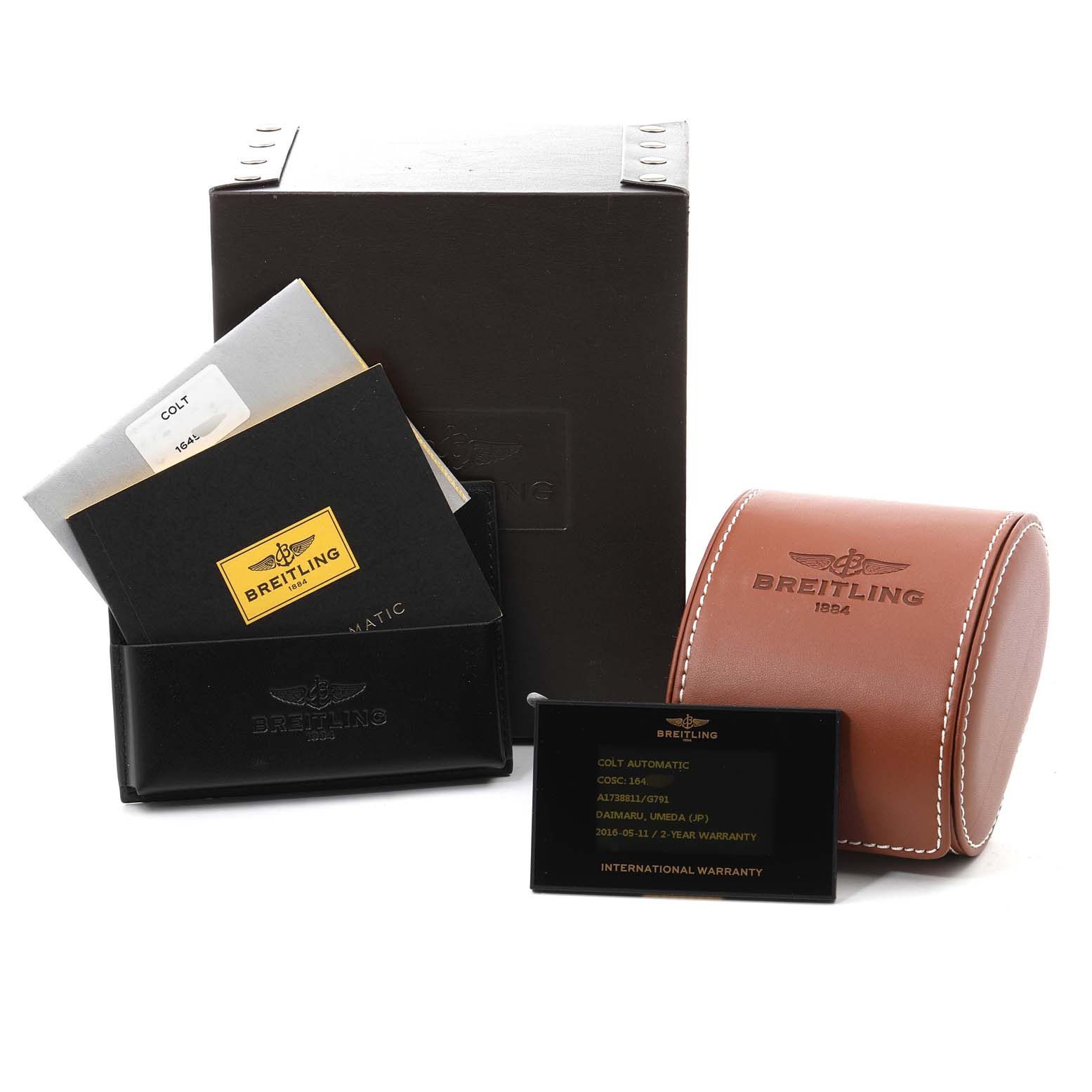 The image shows the packaging, documentation, warranty card, and watch case for a Breitling Colt A17388 Men
s Stainless Steel White Dial A17388 Men
s Stainless Steel White Dial watch.