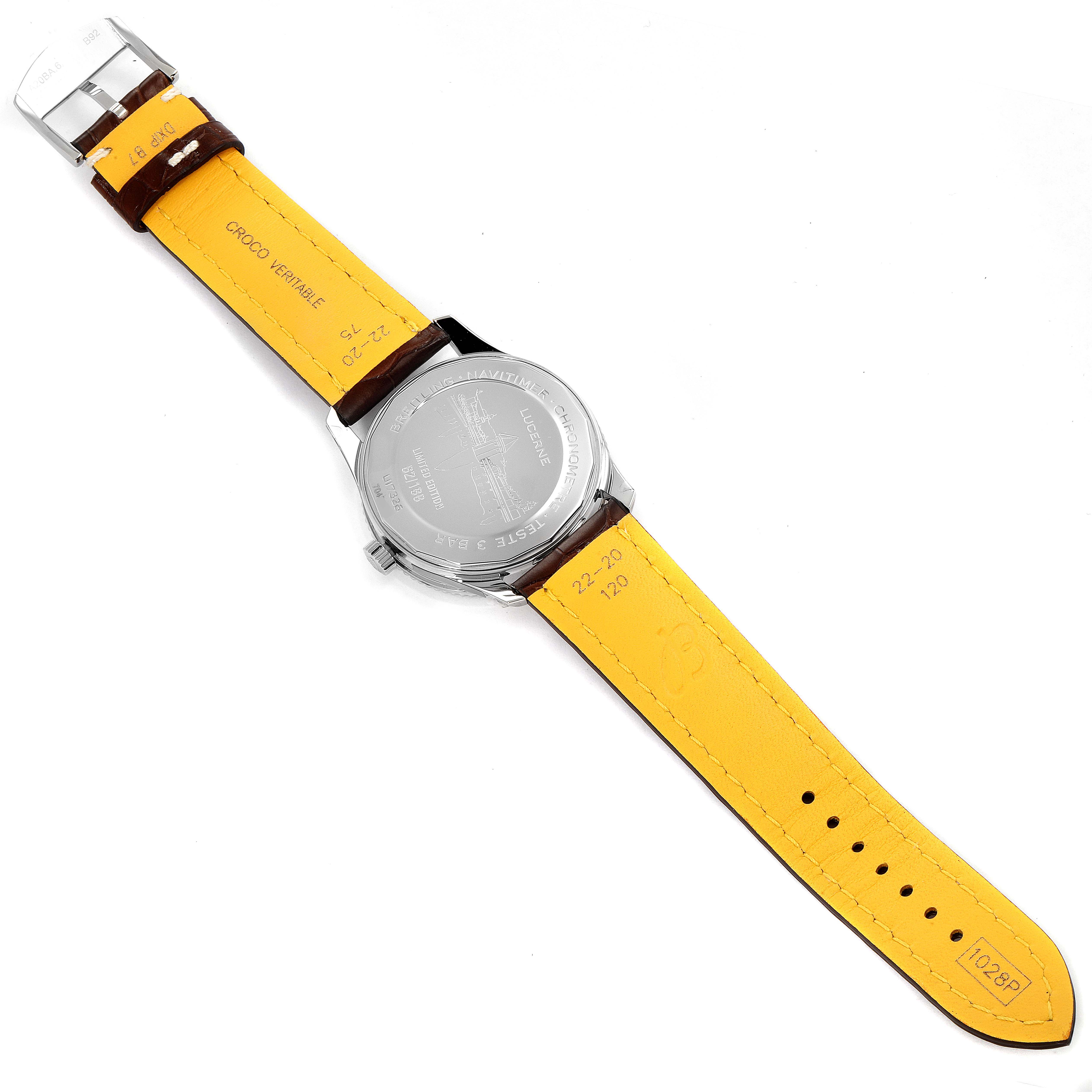 This image shows the back of a Breitling Navitimer U17326211M1P1 Men's Steel and Gold (two tone) Grey Dial U17326211M1P1 Men's Steel and Gold (two tone) Grey Dial watch, displaying the case back and the interior side of the yellow leather strap.