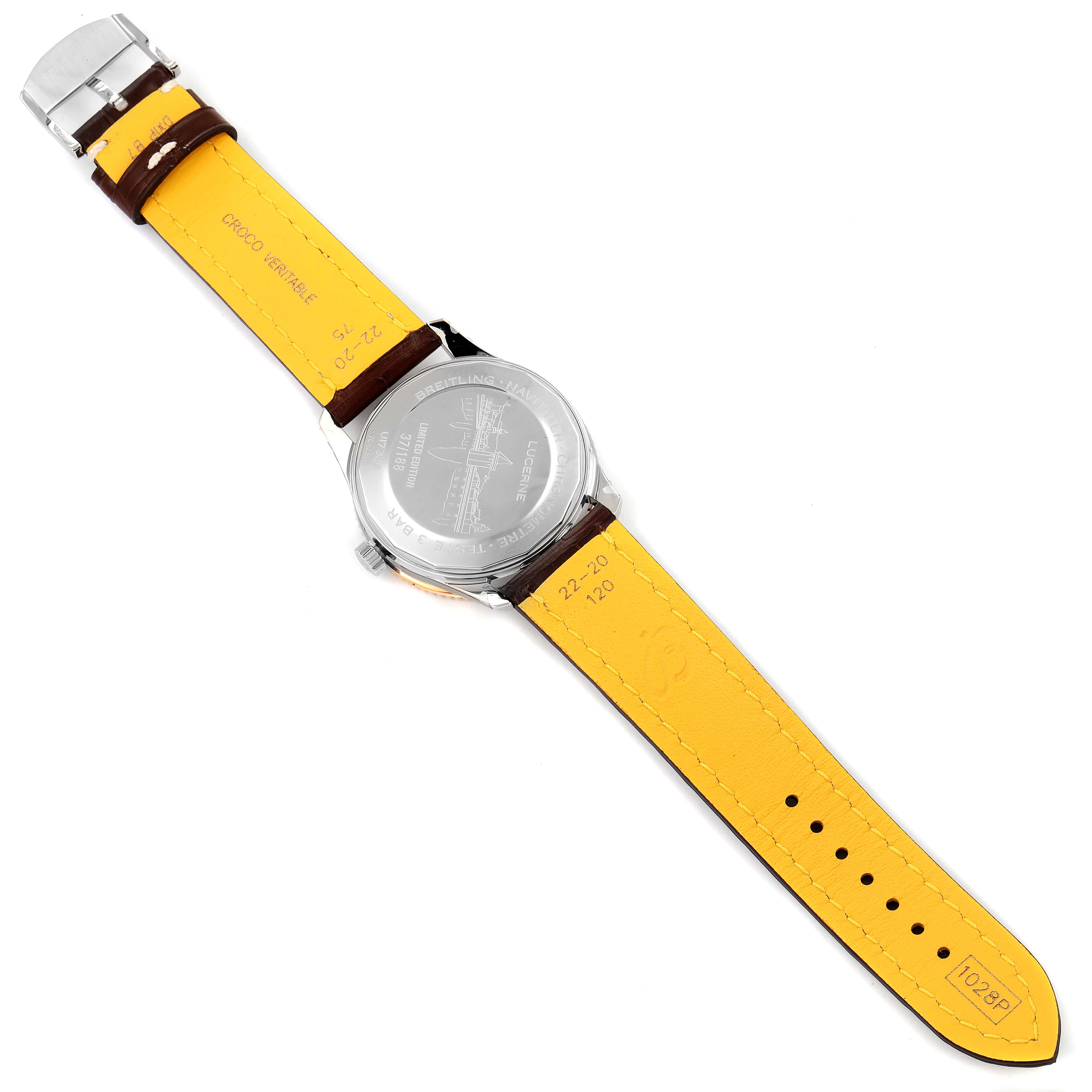 This image shows the underside of the Breitling Navitimer U17326211M1P1 Men
s Stainless Steel Grey Dial U17326211M1P1 Men
s Stainless Steel Grey Dial watch, highlighting the case back and yellow leather strap.