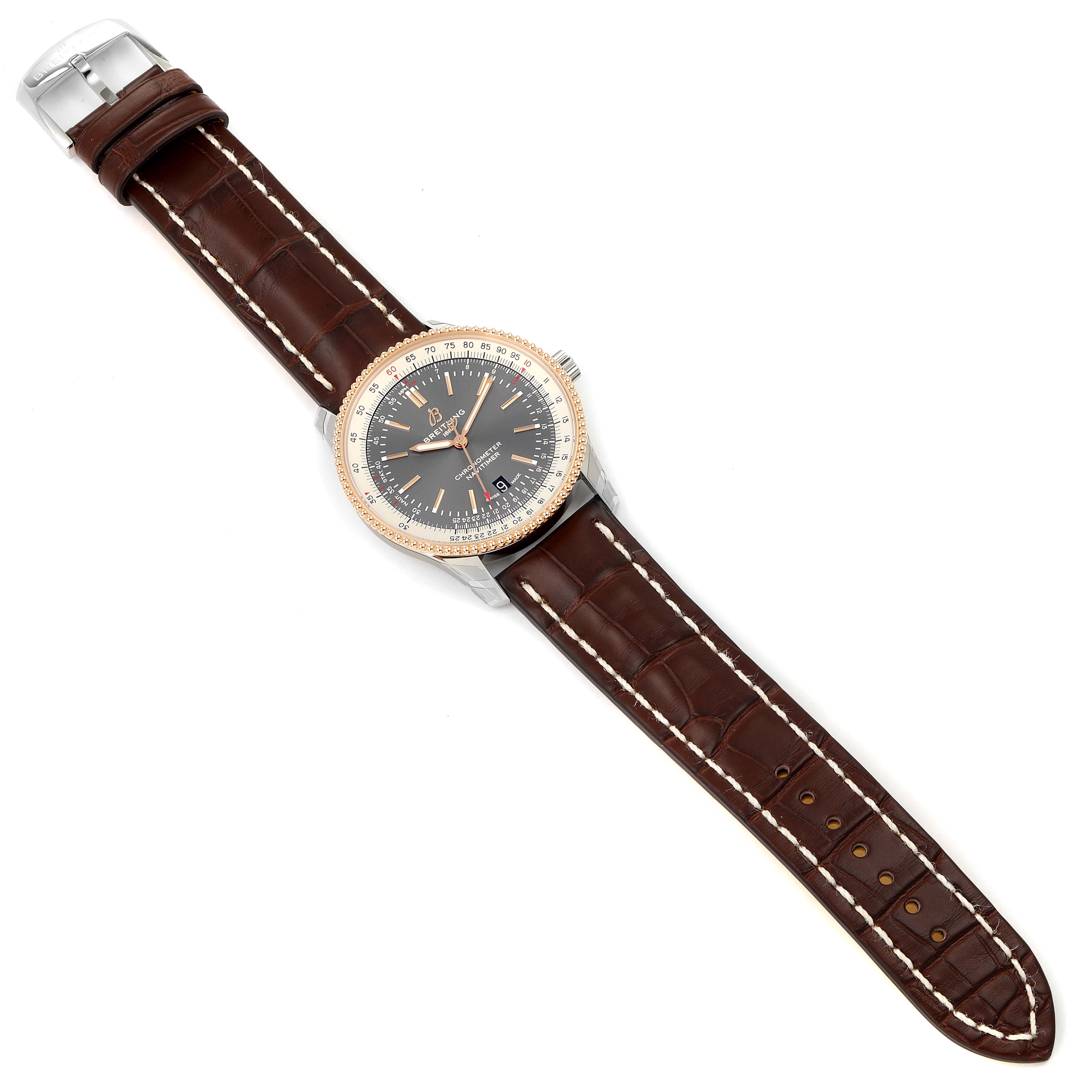 This image shows a top-down view of the Breitling Navitimer U17326211M1P1 Men
s Stainless Steel Grey Dial U17326211M1P1 Men
s Stainless Steel Grey Dial watch, displaying its dial, case, and leather strap.