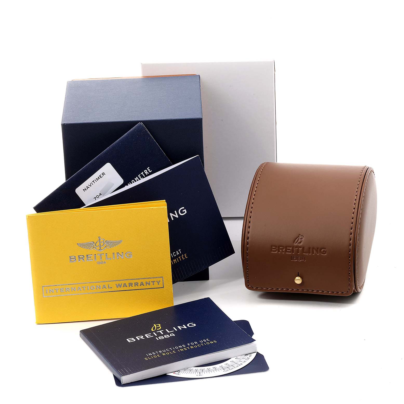 The image shows a Breitling Navitimer U17326211M1P1 Men
s Stainless Steel Grey Dial U17326211M1P1 Men
s Stainless Steel Grey Dial watch package including a brown leather case, warranty cards, instructions, and boxes.