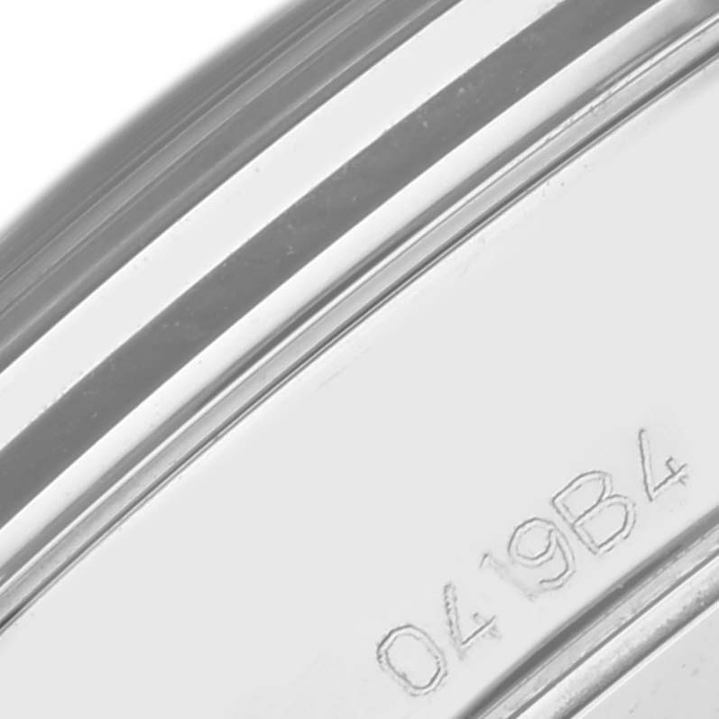 This image shows a close-up of the case back edge with engraved markings on the Premier model by Breitling.