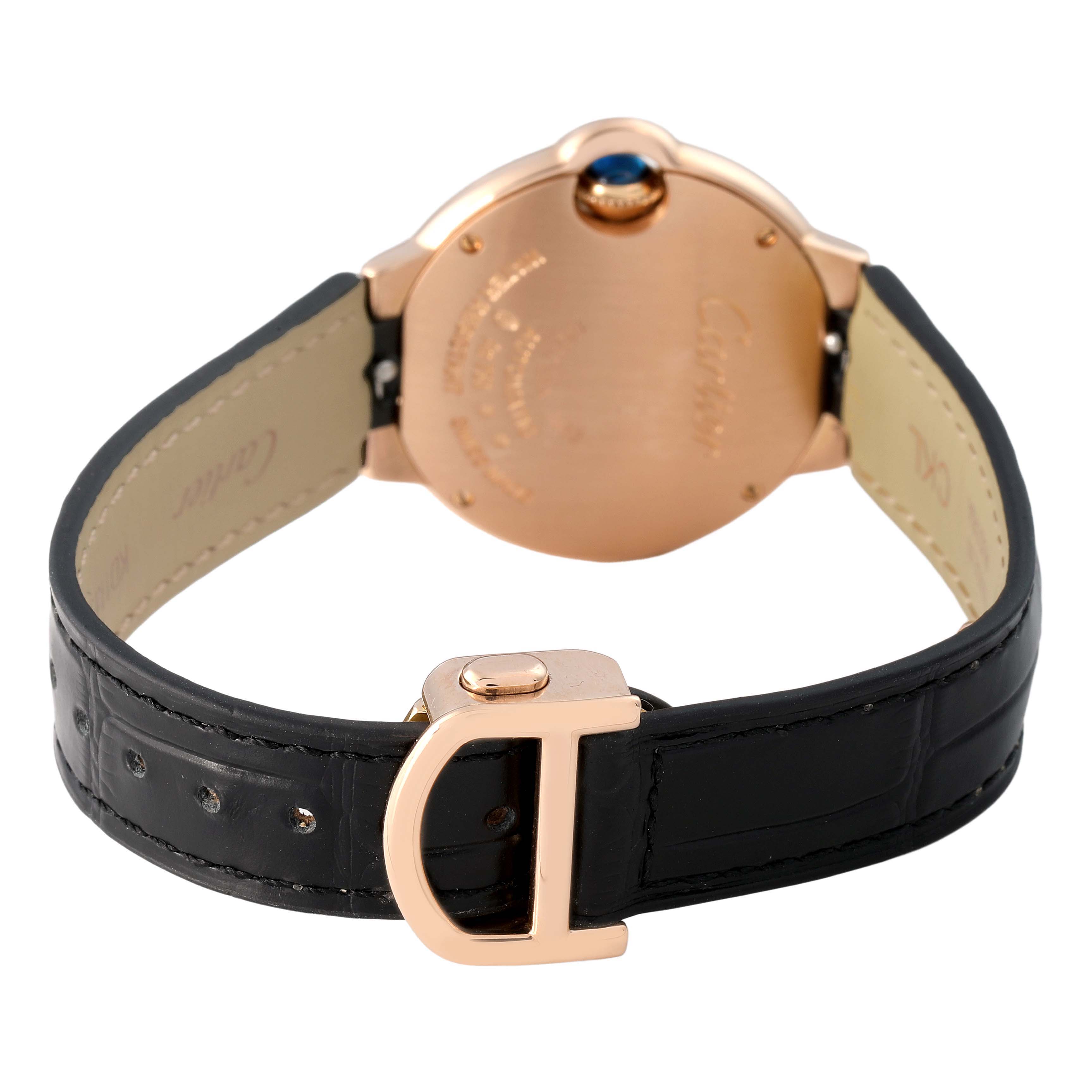 The image shows a Ballon Bleu by Cartier from the back, featuring the clasp, case back, and leather strap.