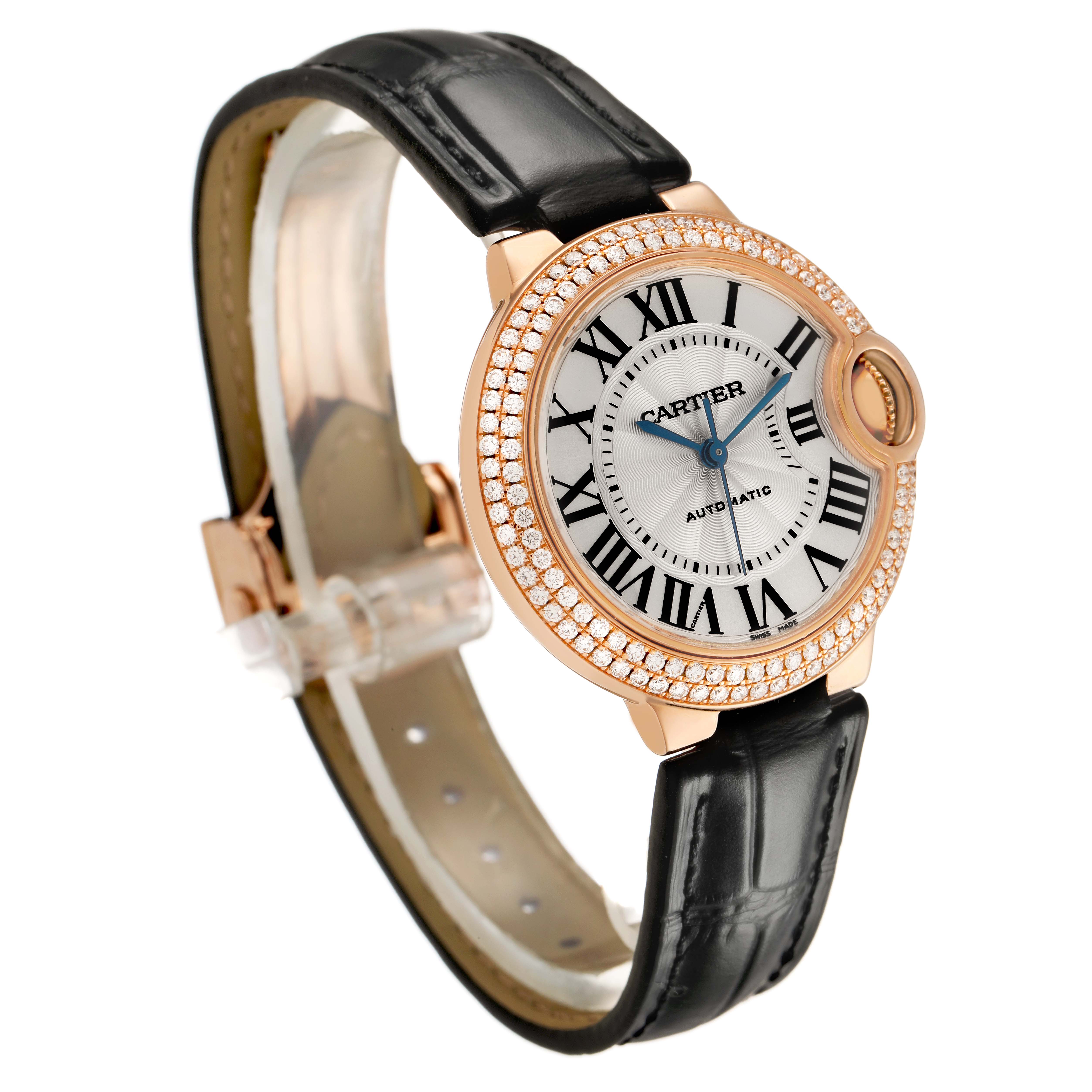 The Cartier Ballon Bleu WE902066 Women's Rose Gold Silver Dial watch is shown at a three-quarter angle, highlighting its diamond-set bezel and black leather strap.