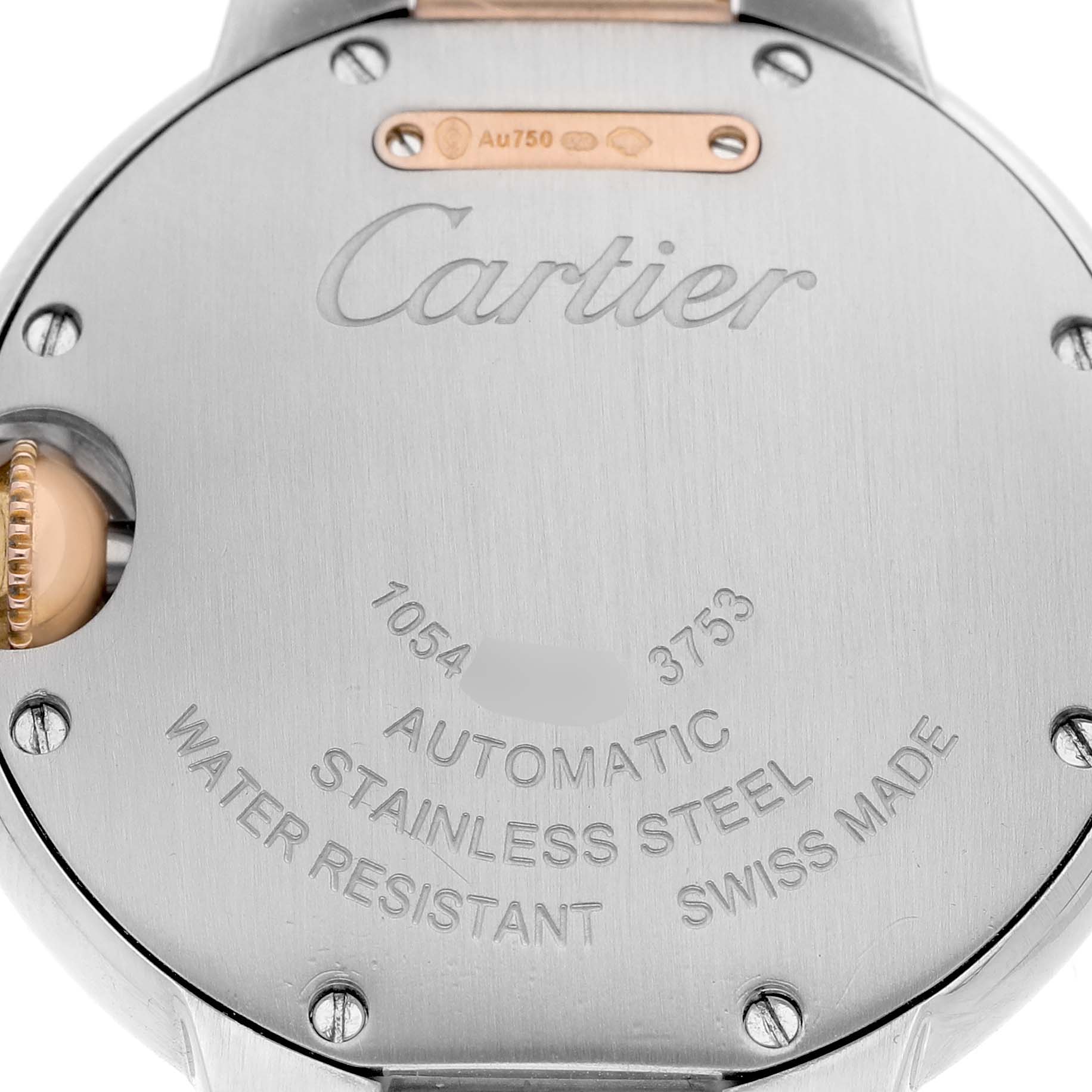 The image shows the back of a Cartier Ballon Bleu WE902077 Women's Steel and Gold (two tone) Silver Dial watch, featuring its stainless steel case and engraved details.