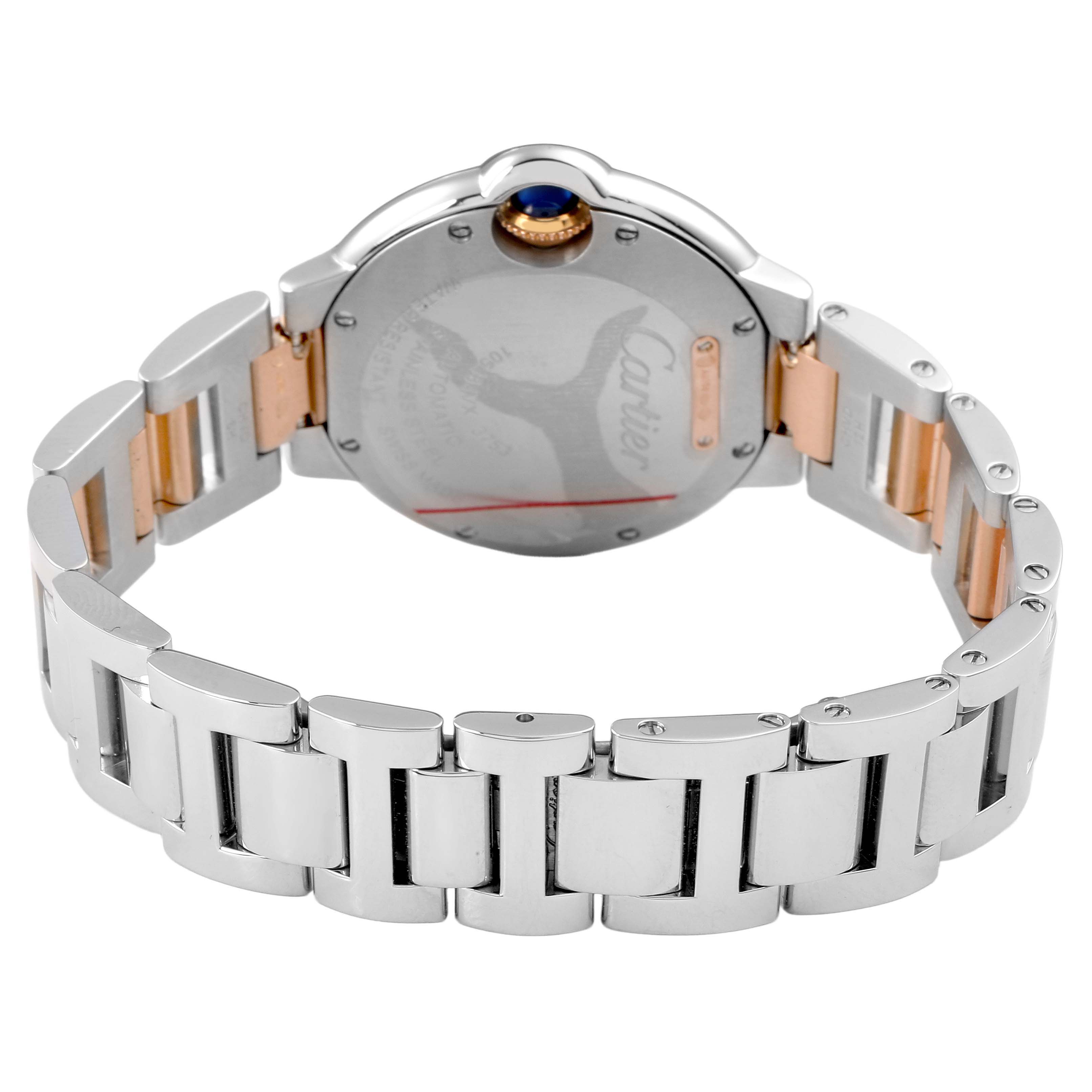 The image shows the back of the Ballon Bleu by Cartier, highlighting the bracelet and case back.