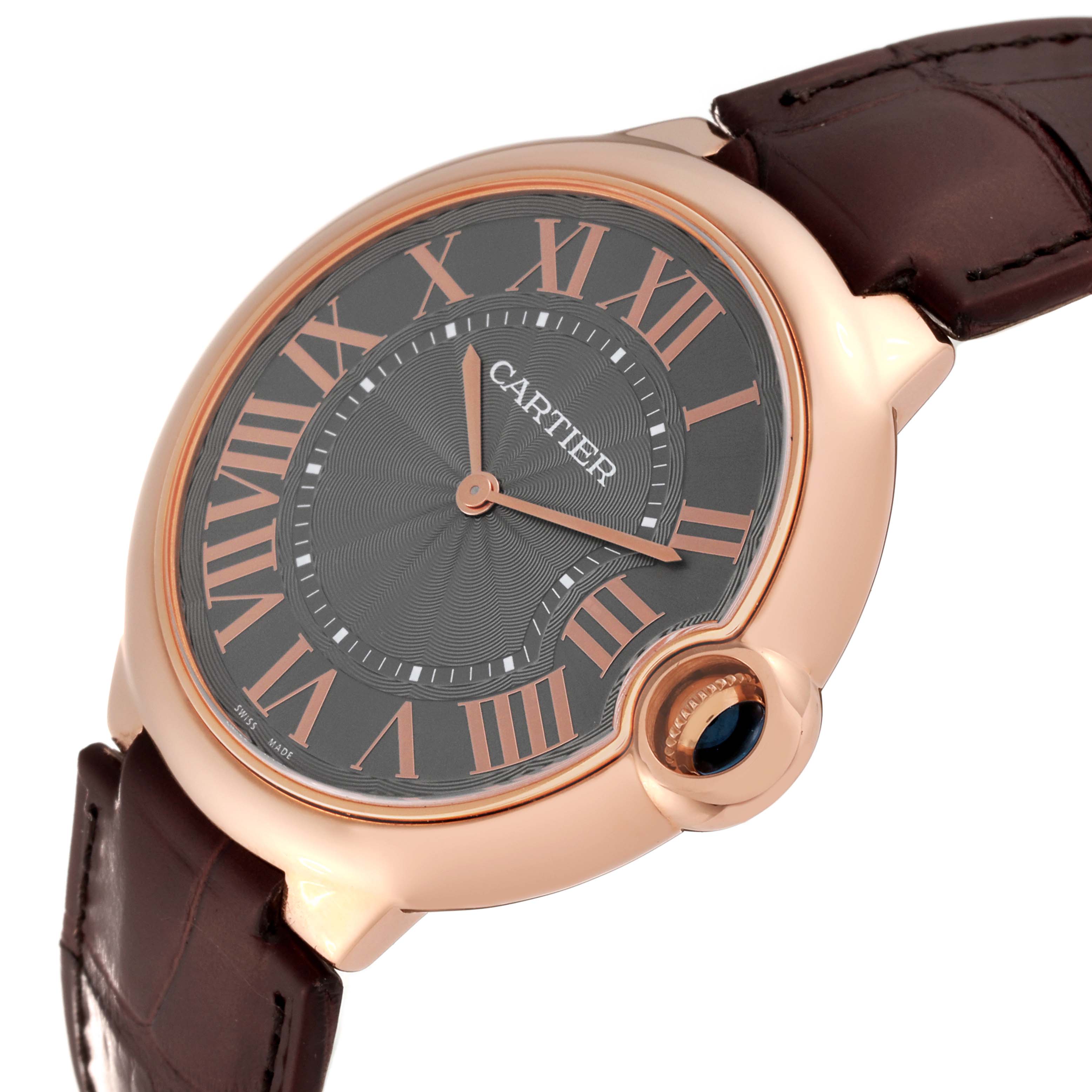 The image shows a close-up, angled view of the Cartier Ballon Bleu W6920089 Men's Rose Gold Grey Dial W6920089 Men's Rose Gold Grey Dial watch, highlighting the dial, hands, crown, and part of the leather strap.