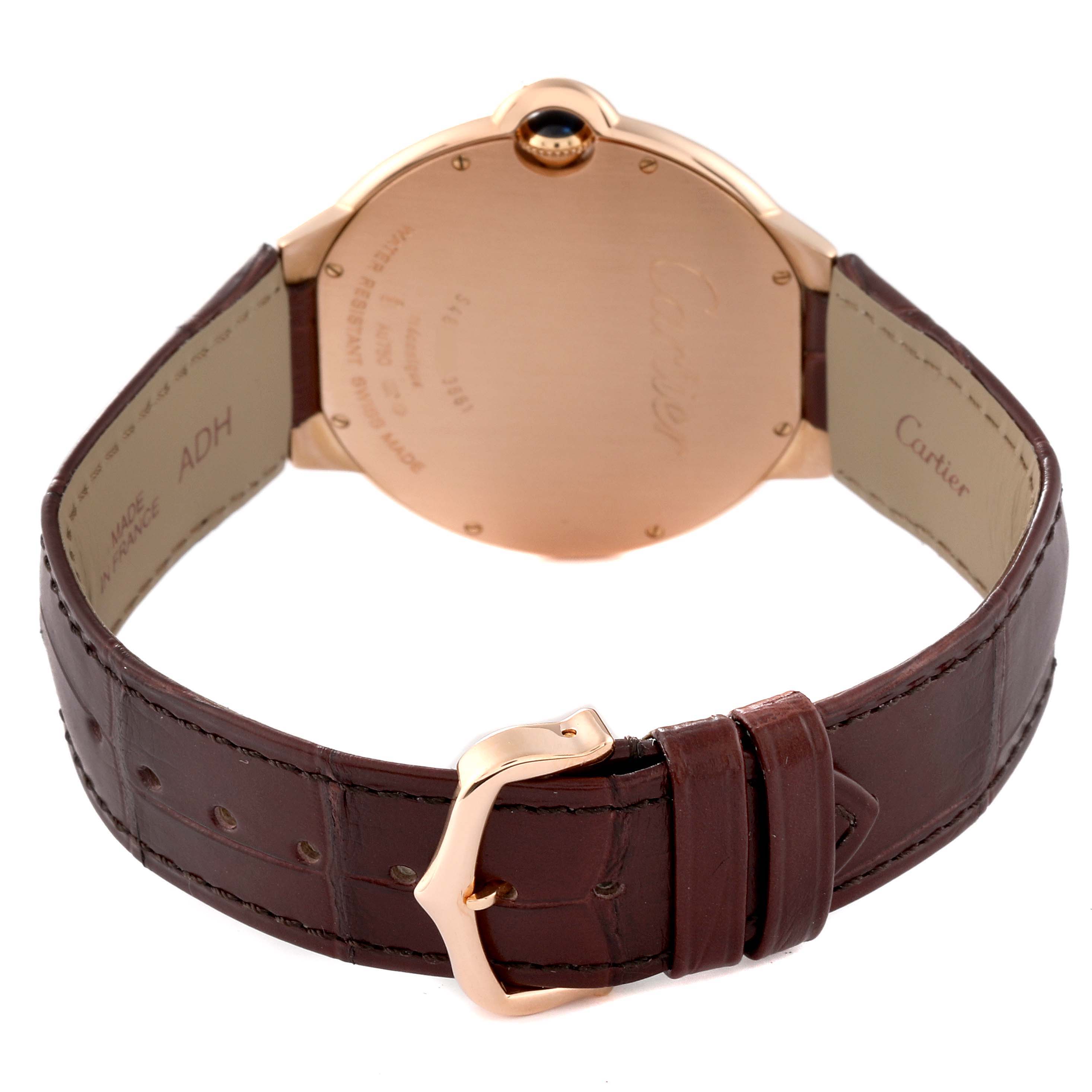 The image shows the back view of a Cartier Ballon Bleu W6920089 Men's Rose Gold Grey Dial W6920089 Men's Rose Gold Grey Dial watch, highlighting its case, brown leather strap, and gold buckle.