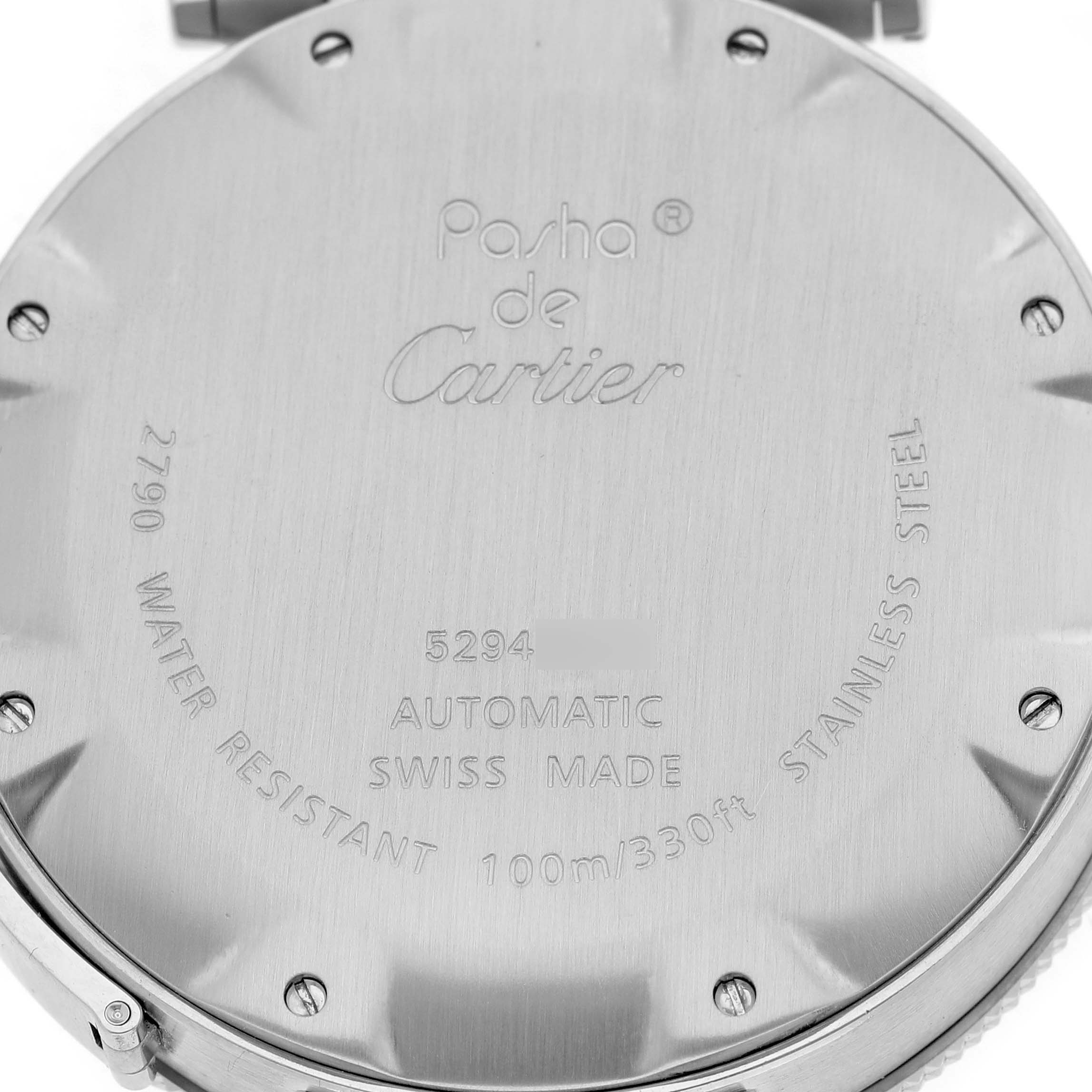 The image shows the back case of a Cartier Pasha W31080M7 Men's Stainless Steel Black Dial watch, displaying engravings and screws.