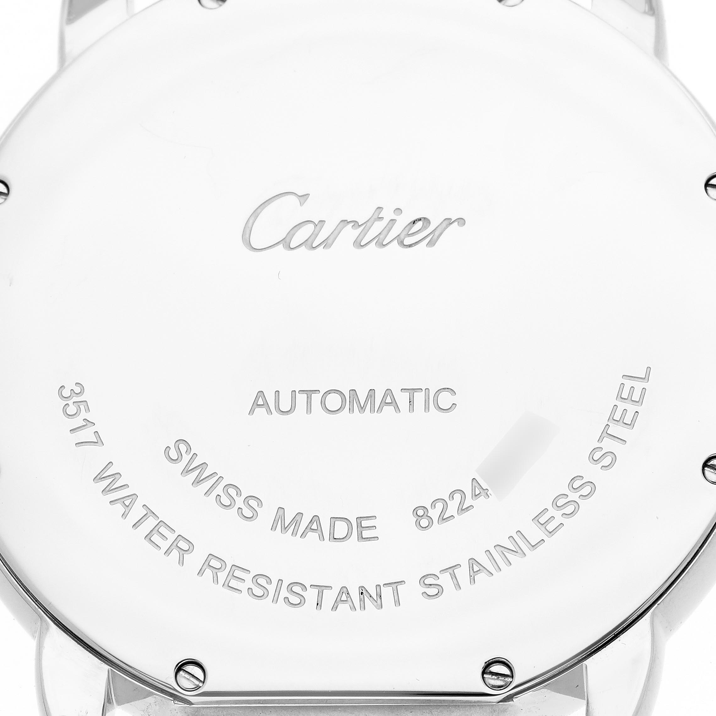 The image shows the back case of a Cartier Ronde W6701011 Men
s Stainless Steel Silver Dial W6701011 Men
s Stainless Steel Silver Dial watch with inscriptions about its features and origin.