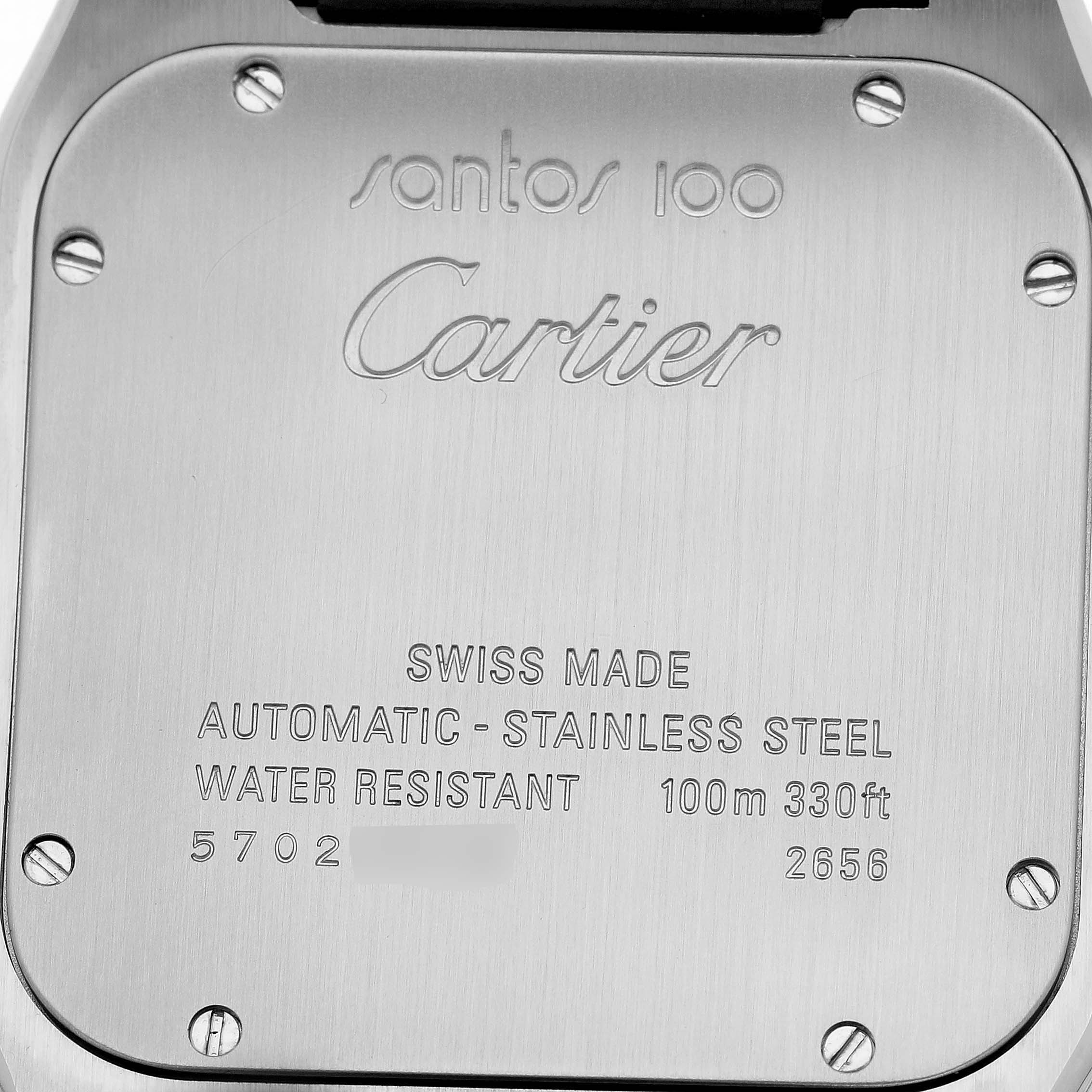 The image shows the back of a Cartier Santos W20073X8 Women's Stainless Steel Silver Dial watch, displaying engravings and screws.