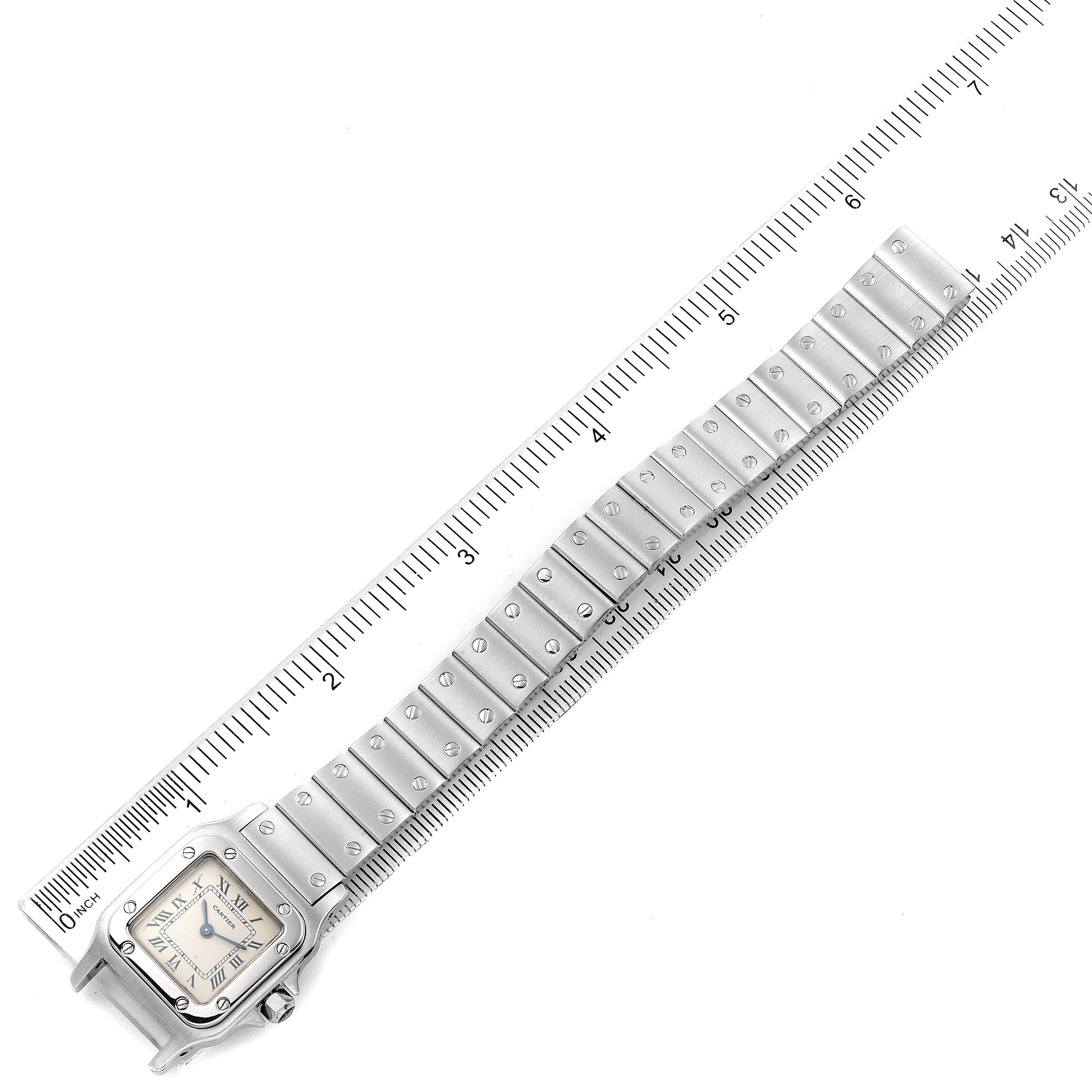 The image shows a Cartier Santos W20056D6 Women's Stainless Steel Silver Dial W20056D6 Women's Stainless Steel Silver Dial watch laid out flat with the full length of the band, adjacent to a ruler for measurement.