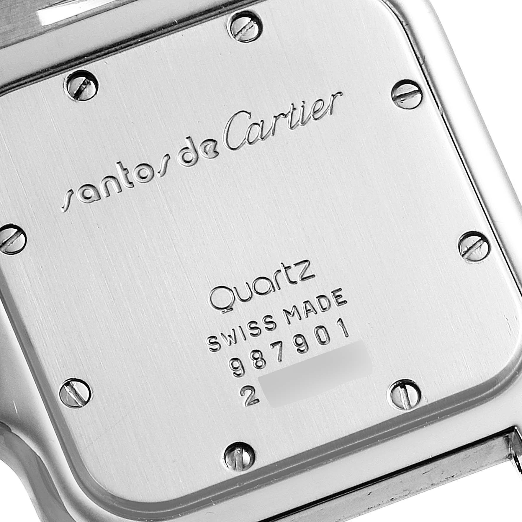 This image shows the back case of a Santos model by Cartier, displaying the brand, model, and serial number.