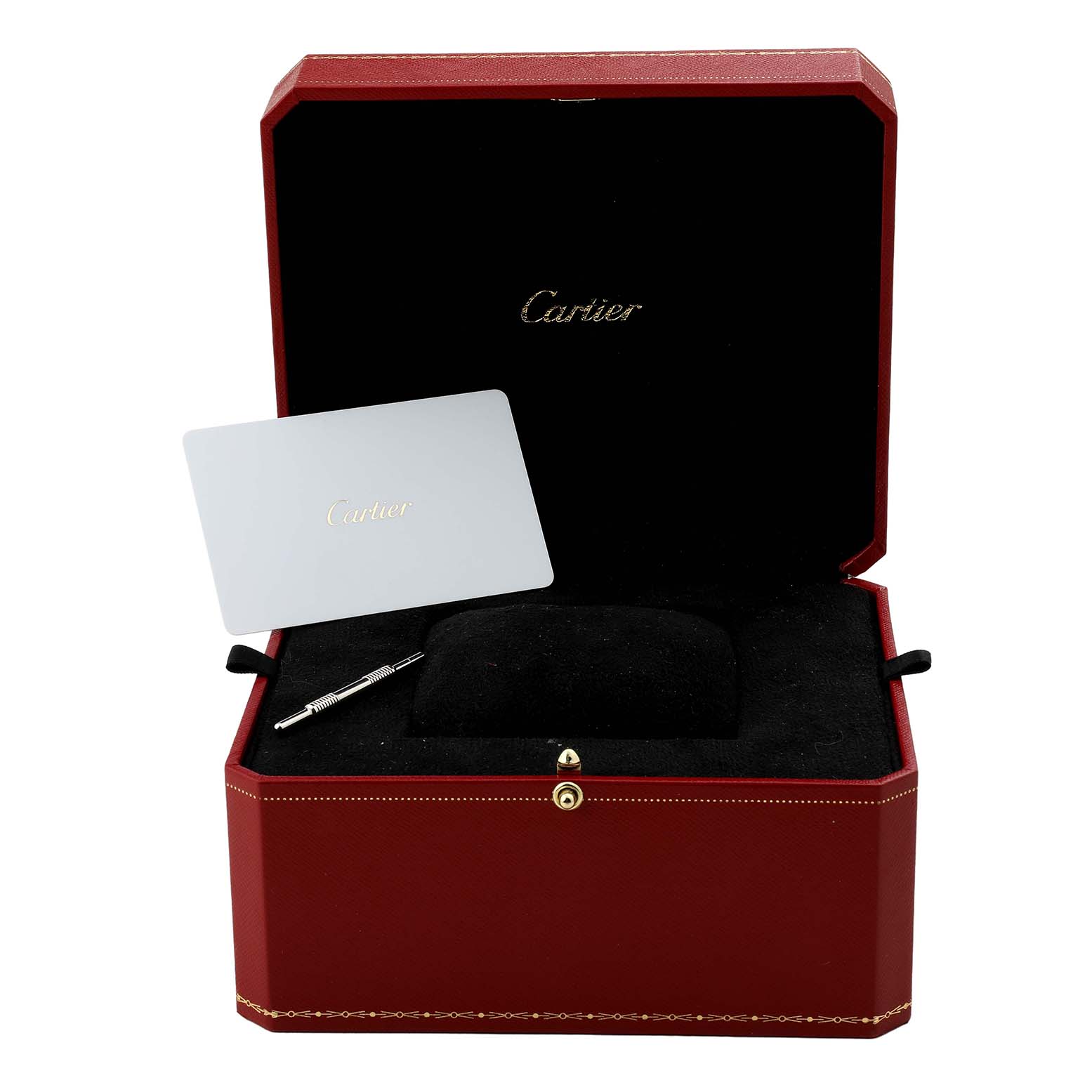 The image shows the open red box of a Cartier Santos WSSA0029 Men's Stainless Steel Silver Dial watch, revealing a card and tool inside.
