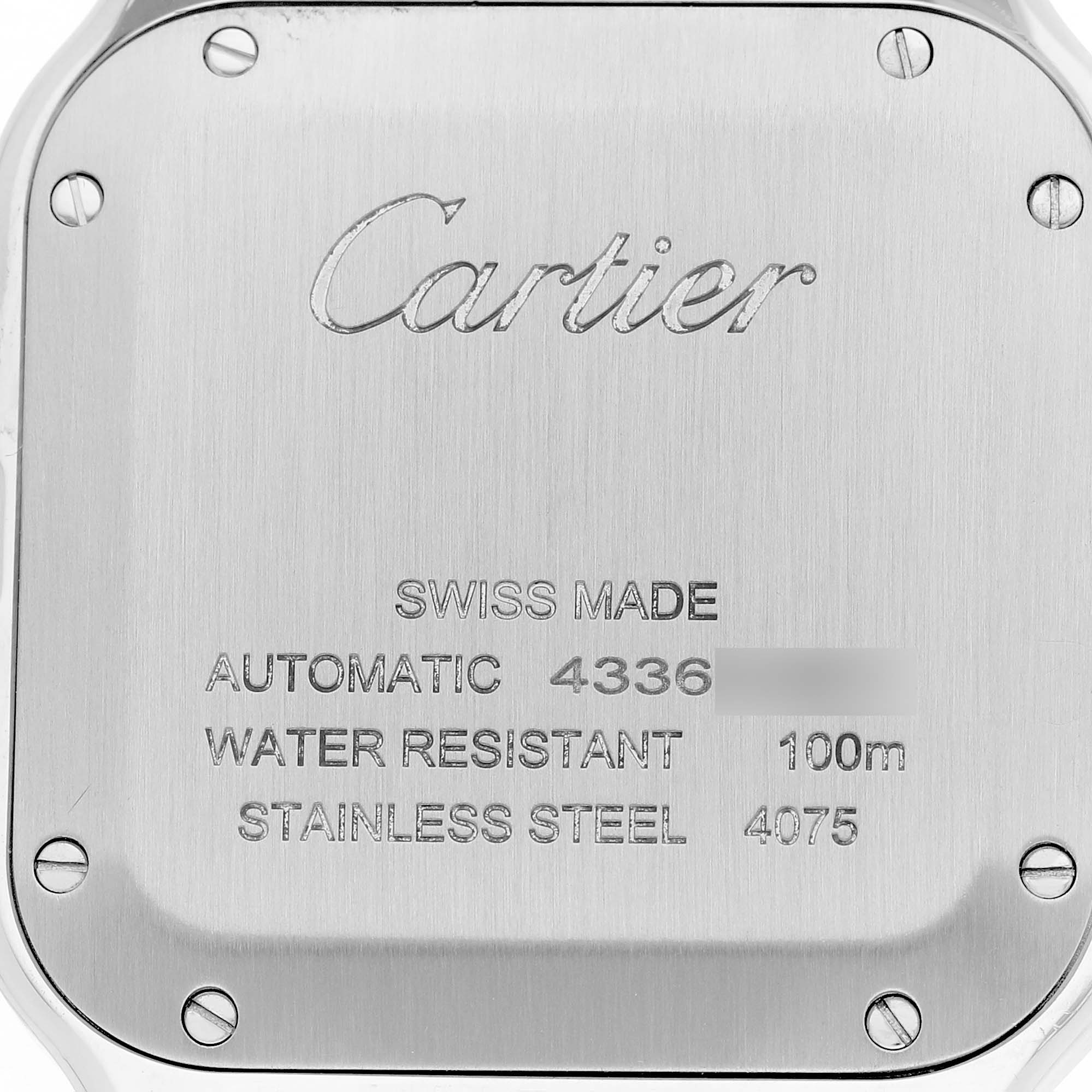 The image shows the back case of a Cartier Santos WSSA0029 Men's Stainless Steel Silver Dial watch, highlighting its screws, engravings, and material details.