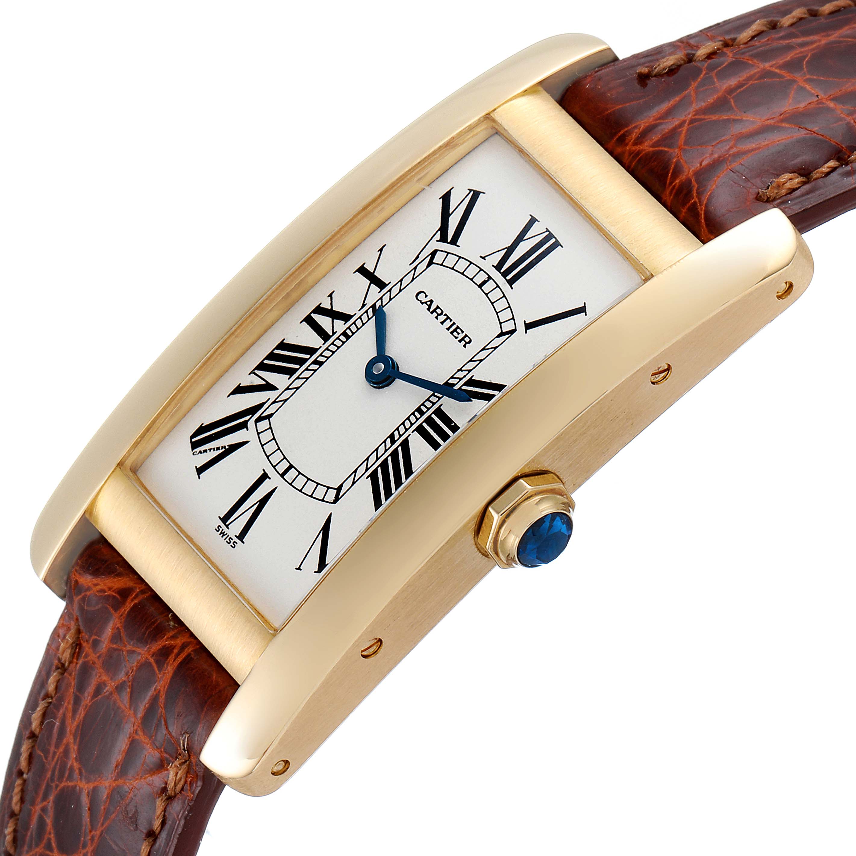 This image shows a Cartier Tank Americaine W2601456 Men's Yellow Gold Silver Dial W2601456 Men's Yellow Gold Silver Dial watch at an angled view, highlighting its gold case, white dial, blue hands, and brown leather strap.