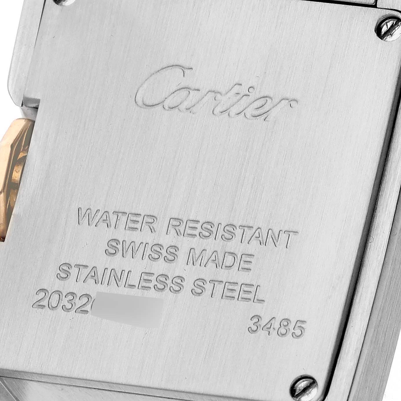 This close-up image shows the back case of the Cartier Tank Anglaise W5310036 Women's Steel and Gold (two tone) Silver Dial W5310036 Women's Steel and Gold (two tone) Silver Dial watch, highlighting its engraved details.