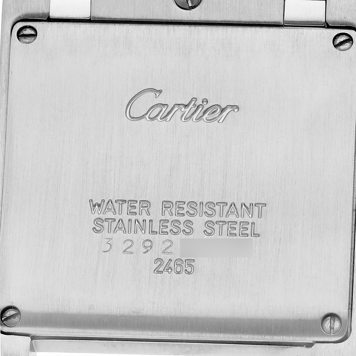 The image shows the back case of a Cartier Tank Francaise W51011Q3 Women's Stainless Steel Silver Dial W51011Q3 Women's Stainless Steel Silver Dial watch highlighting the brand name and model details.