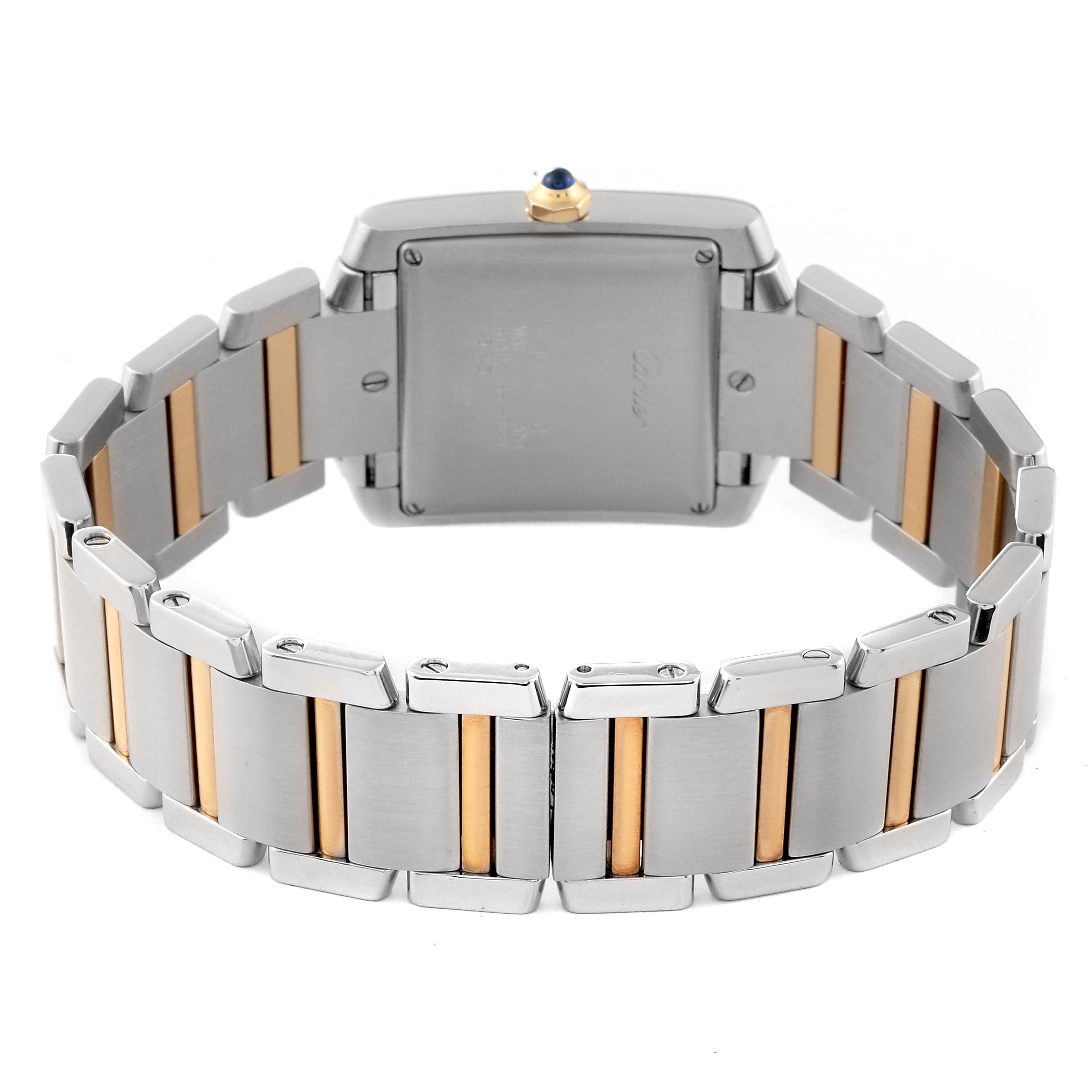 This image shows the backside of a Cartier Tank Francaise W51005Q4 Men's Steel and Gold (two tone) Silver Dial W51005Q4 Men's Steel and Gold (two tone) Silver Dial watch, highlighting its metal bracelet with gold accents and the case back.