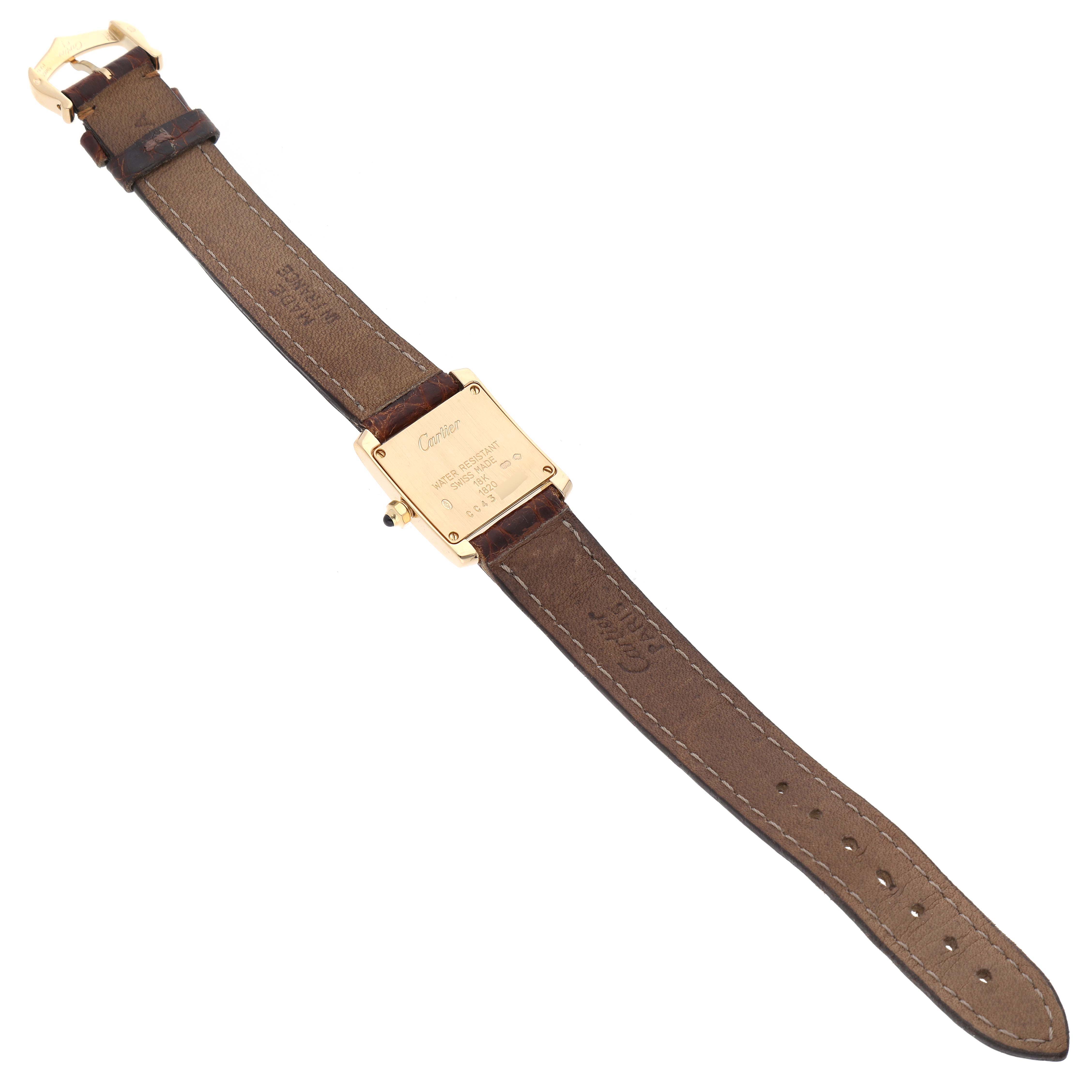 The image shows the back and strap of the Tank Francaise model by Cartier, highlighting the case and leather band.