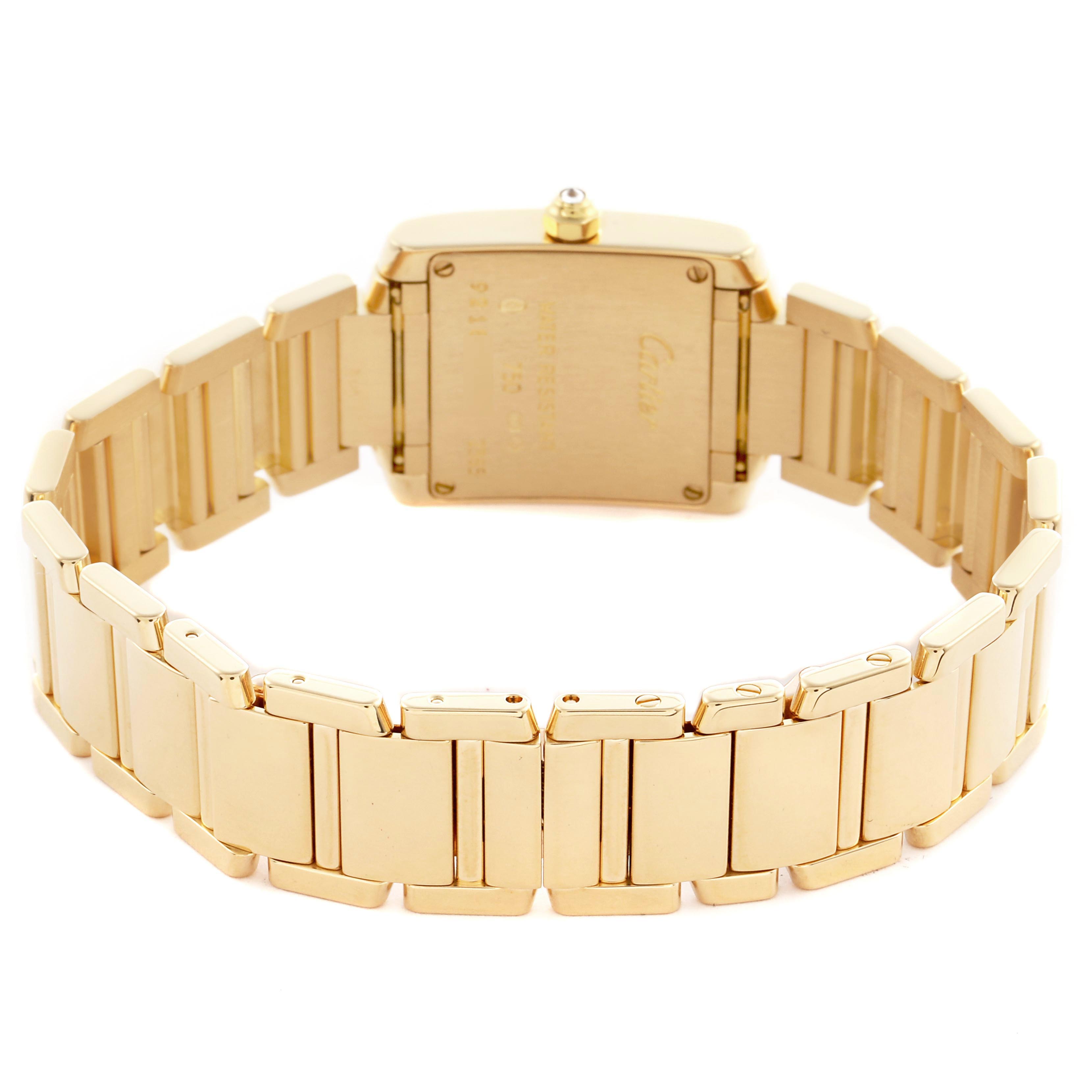 The Cartier Tank Française watch is shown from the back, highlighting the bracelet and case back.
