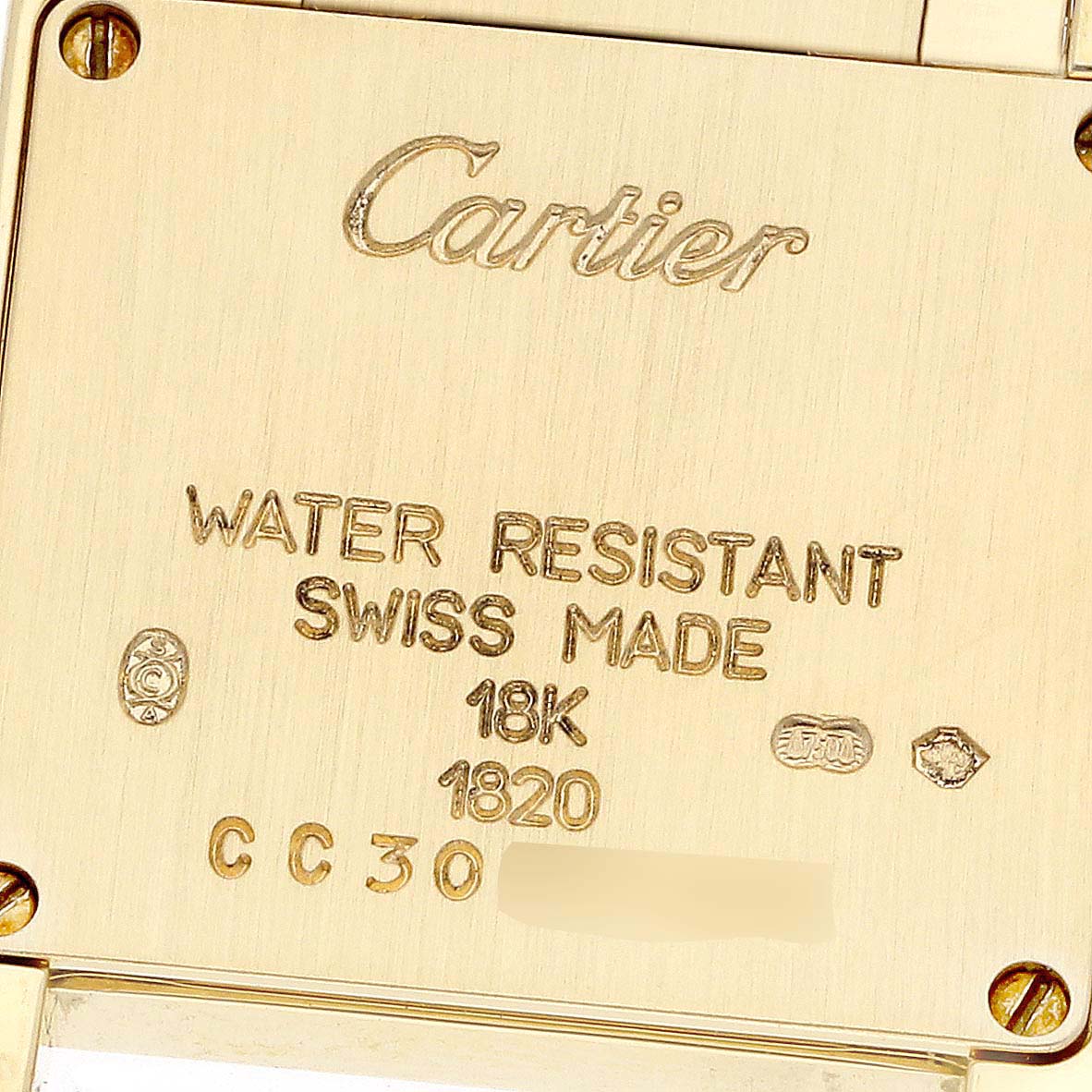 The image shows the back casing of a Cartier Tank Francaise W50002N2 Women's Yellow Gold Silver Dial W50002N2 Women's Yellow Gold Silver Dial watch, highlighting the engraved details and markings.