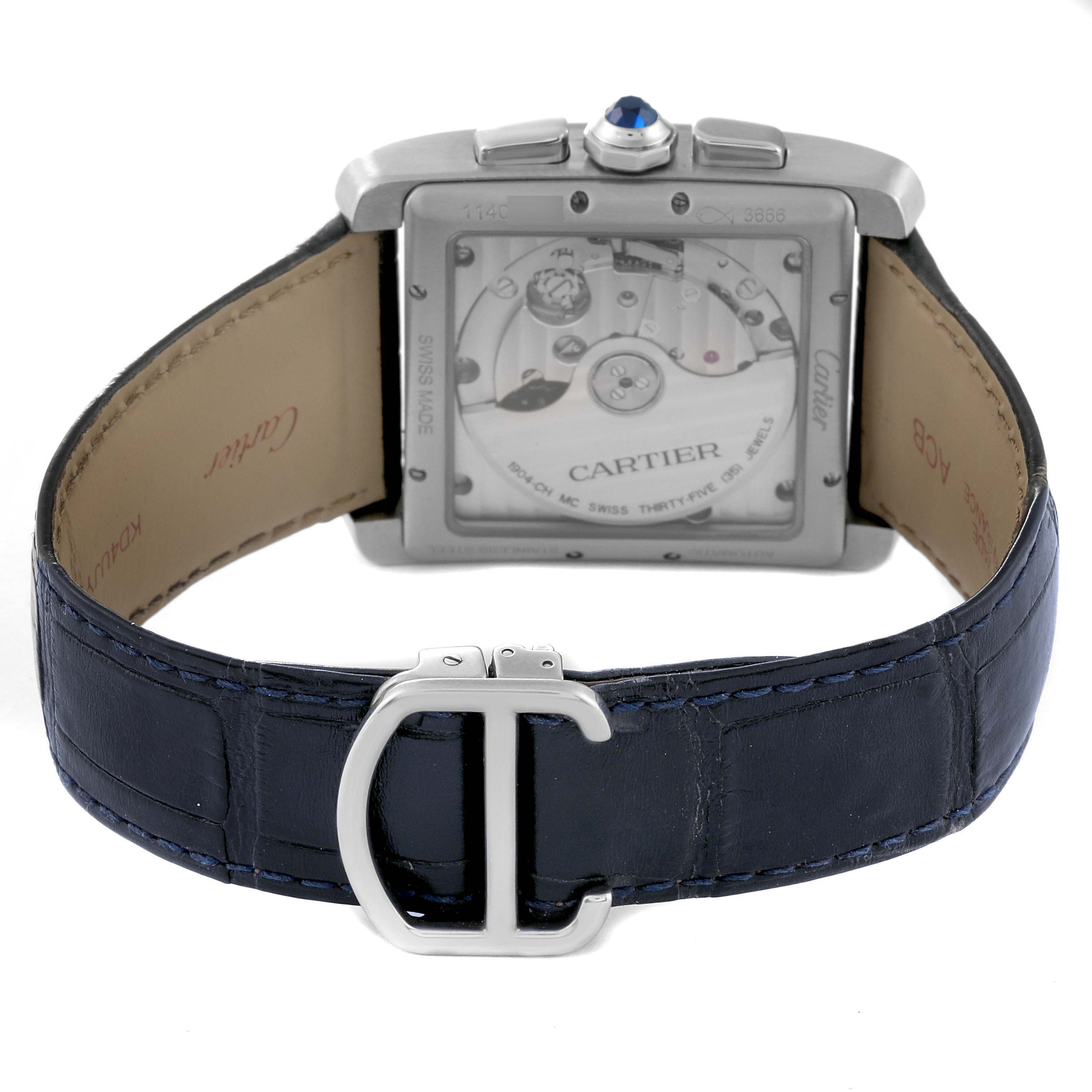 The image shows the back view of the Tank MC model by Cartier, highlighting the mechanical movement and blue leather strap with buckle.