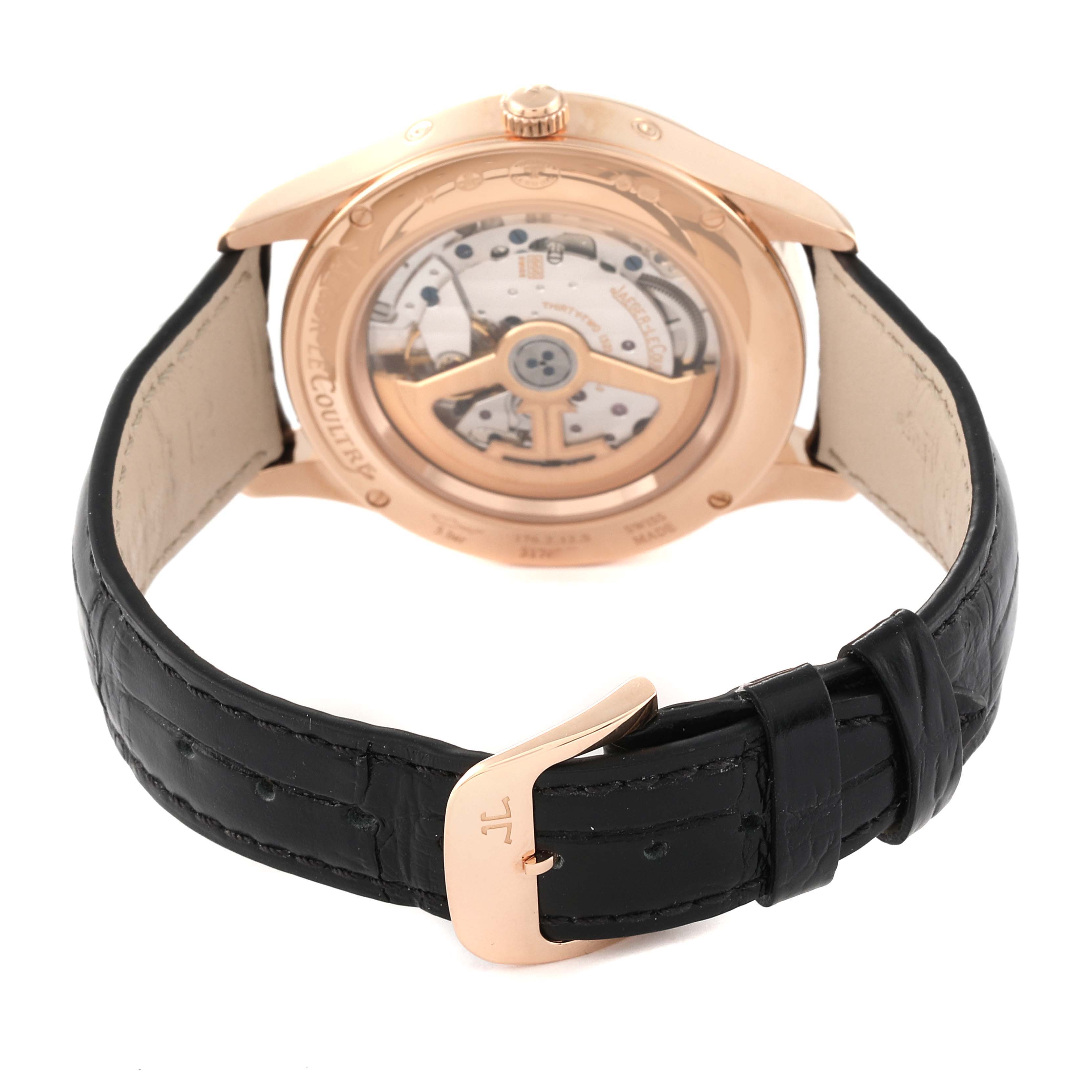 The image shows the back view of the Jaeger LeCoultre Master Q1552540 Men's Rose Gold Silver Dial Q1552540 Men's Rose Gold Silver Dial model watch featuring its internal mechanism and black leather strap.