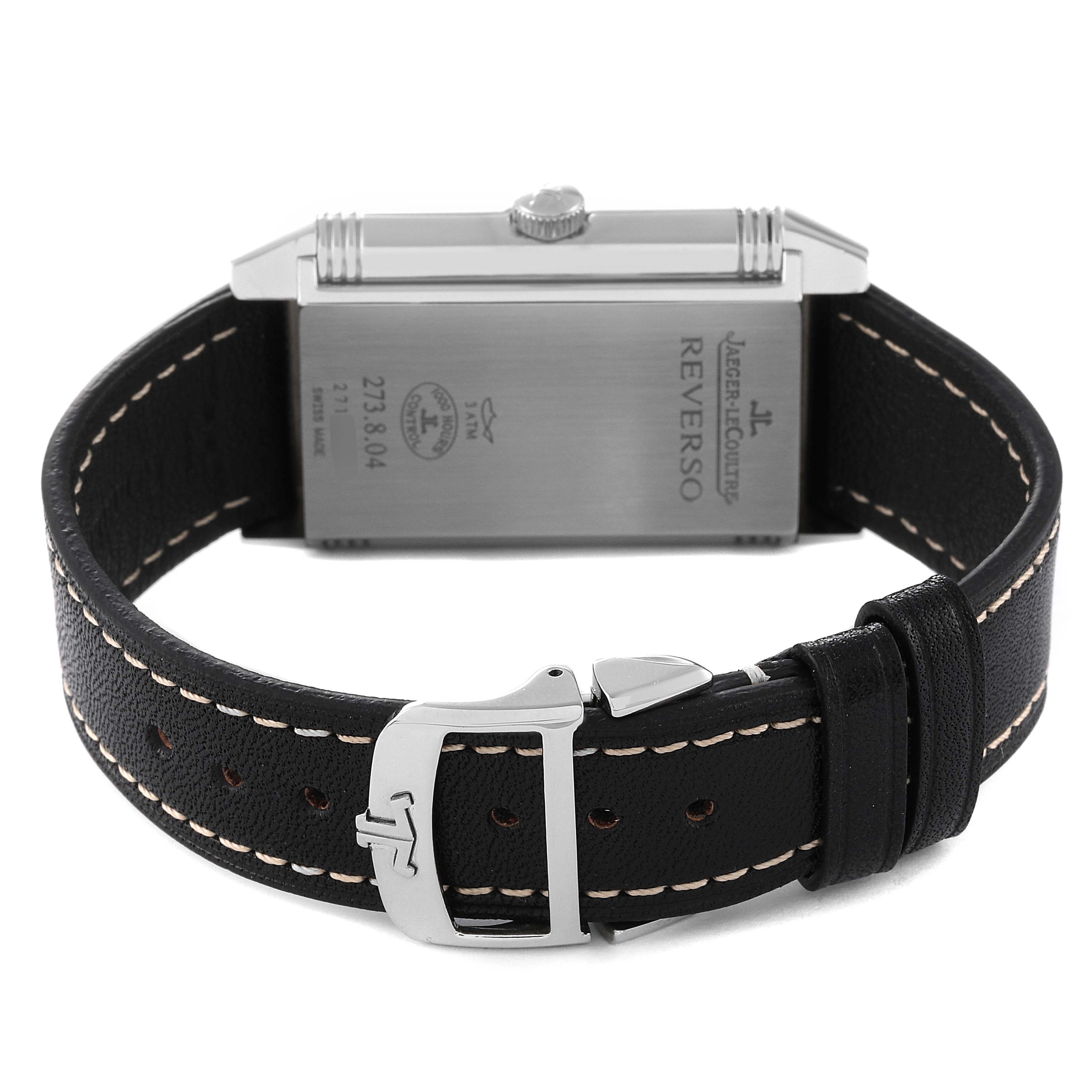 This image shows the back of a Jaeger LeCoultre Reverso Q3738470 Men's Stainless Steel Black Dial Q3738470 Men's Stainless Steel Black Dial watch and its black leather strap with a metal buckle.