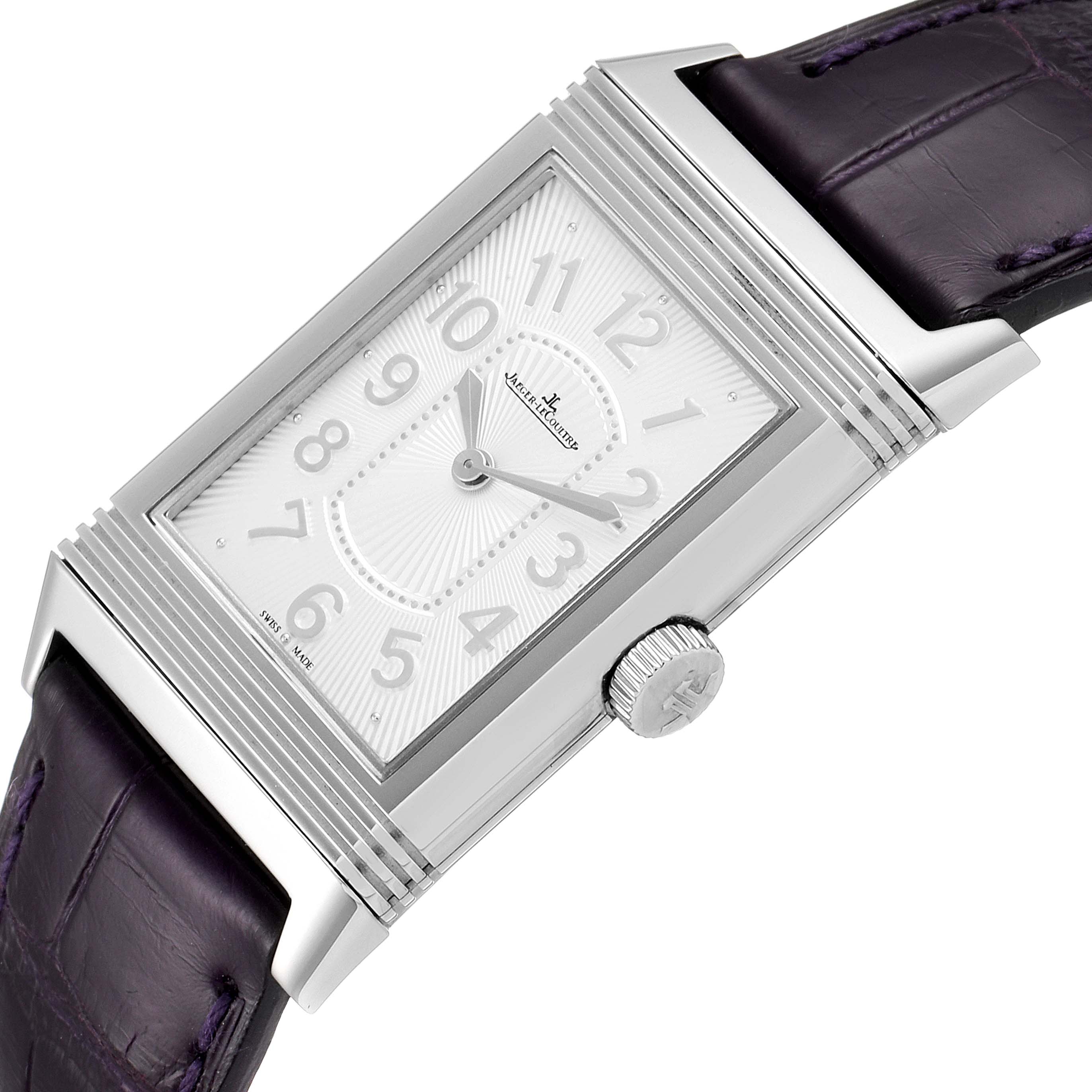The image shows a close-up, angled view of the face and crown of a Jaeger-LeCoultre Reverso watch with a leather strap.
