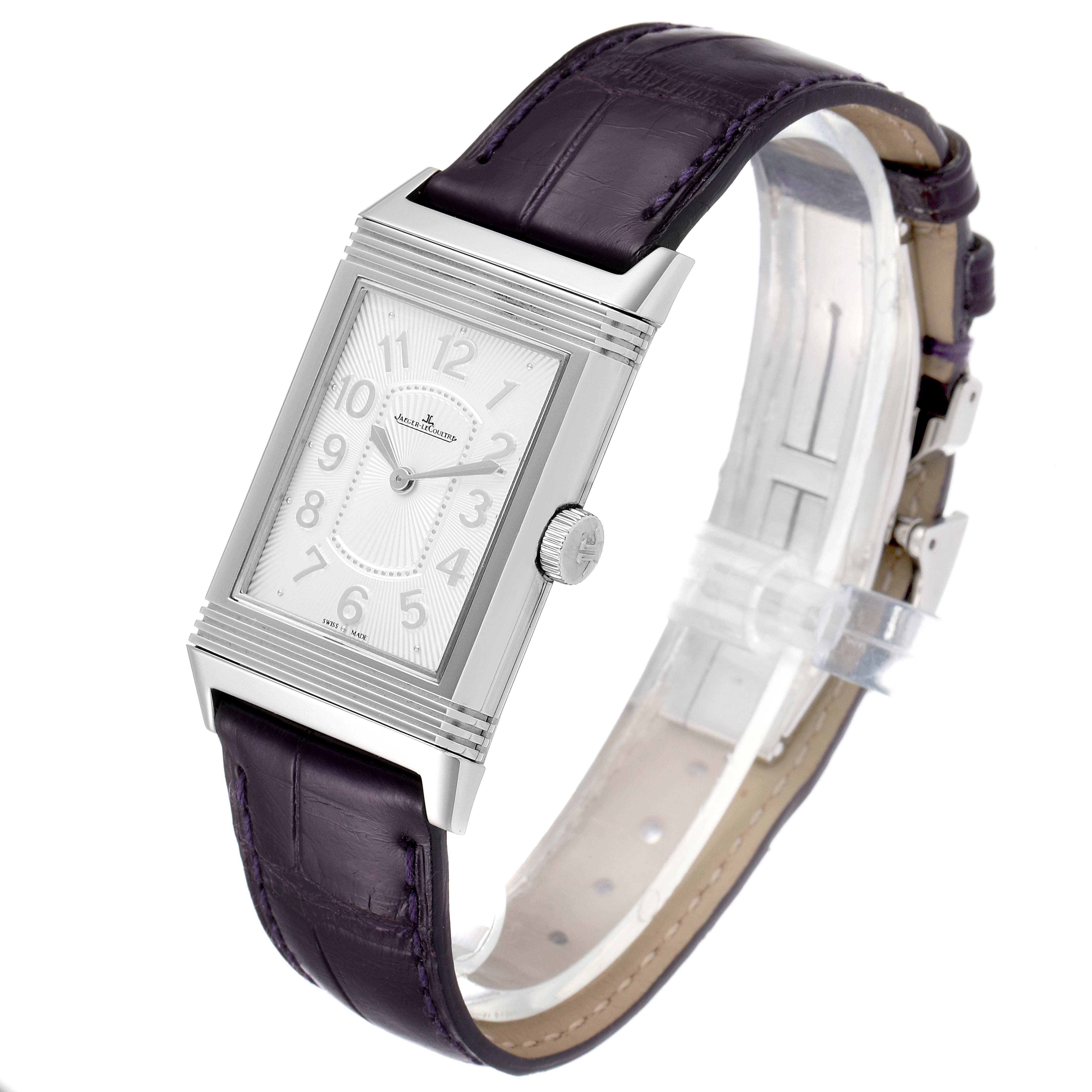 The image shows a Jaeger-LeCoultre Reverso watch at an angle that highlights its rectangular dial, crown, and leather strap.