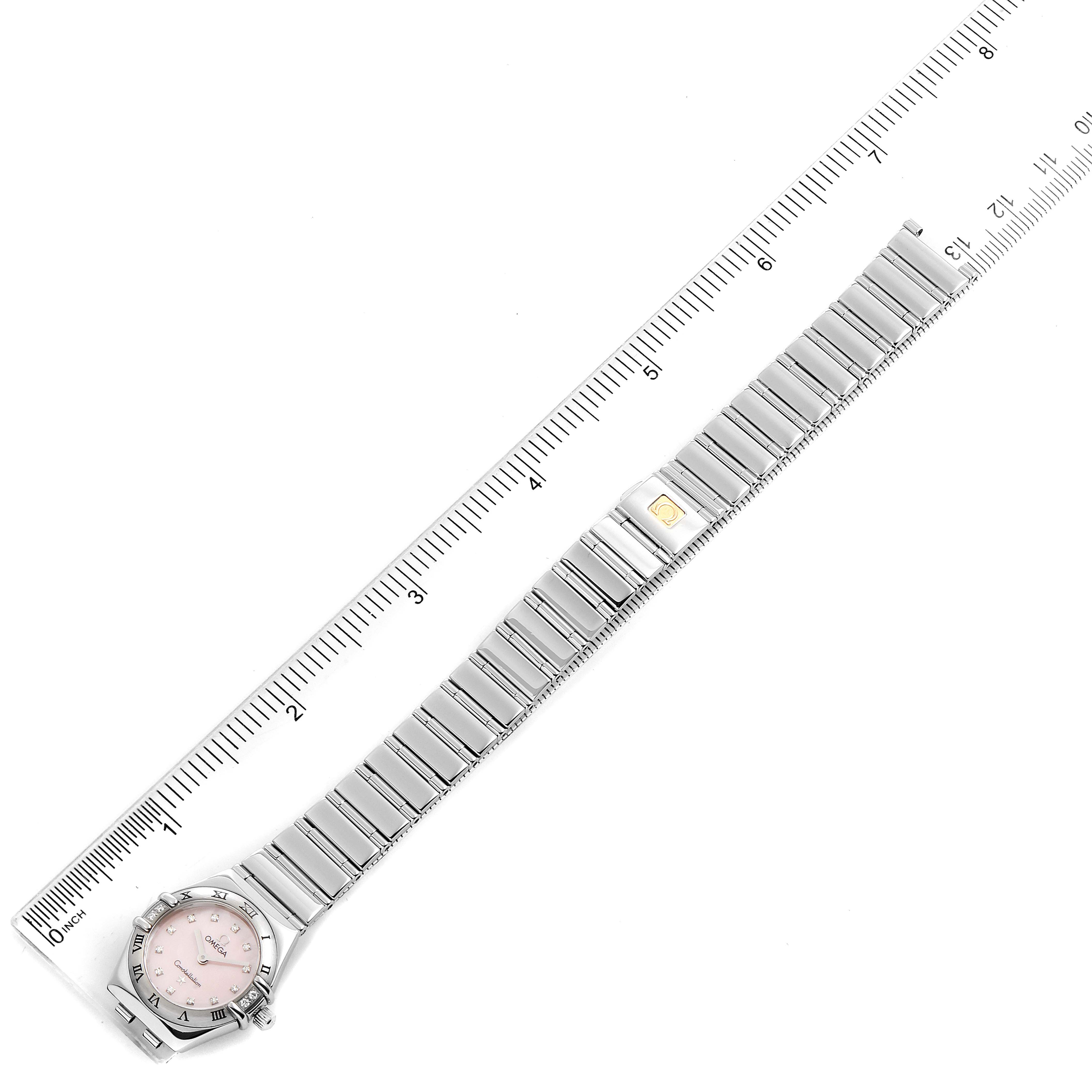 The image shows an Omega 1566.66.00 Women's Stainless Steel Mother of Pearl Dial 1566.66.00 Women's Stainless Steel Mother of Pearl Dial Constellation Mini Pink MOP Diamonds Ladies Watch 1566.66.00 fully extended with a measuring scale.