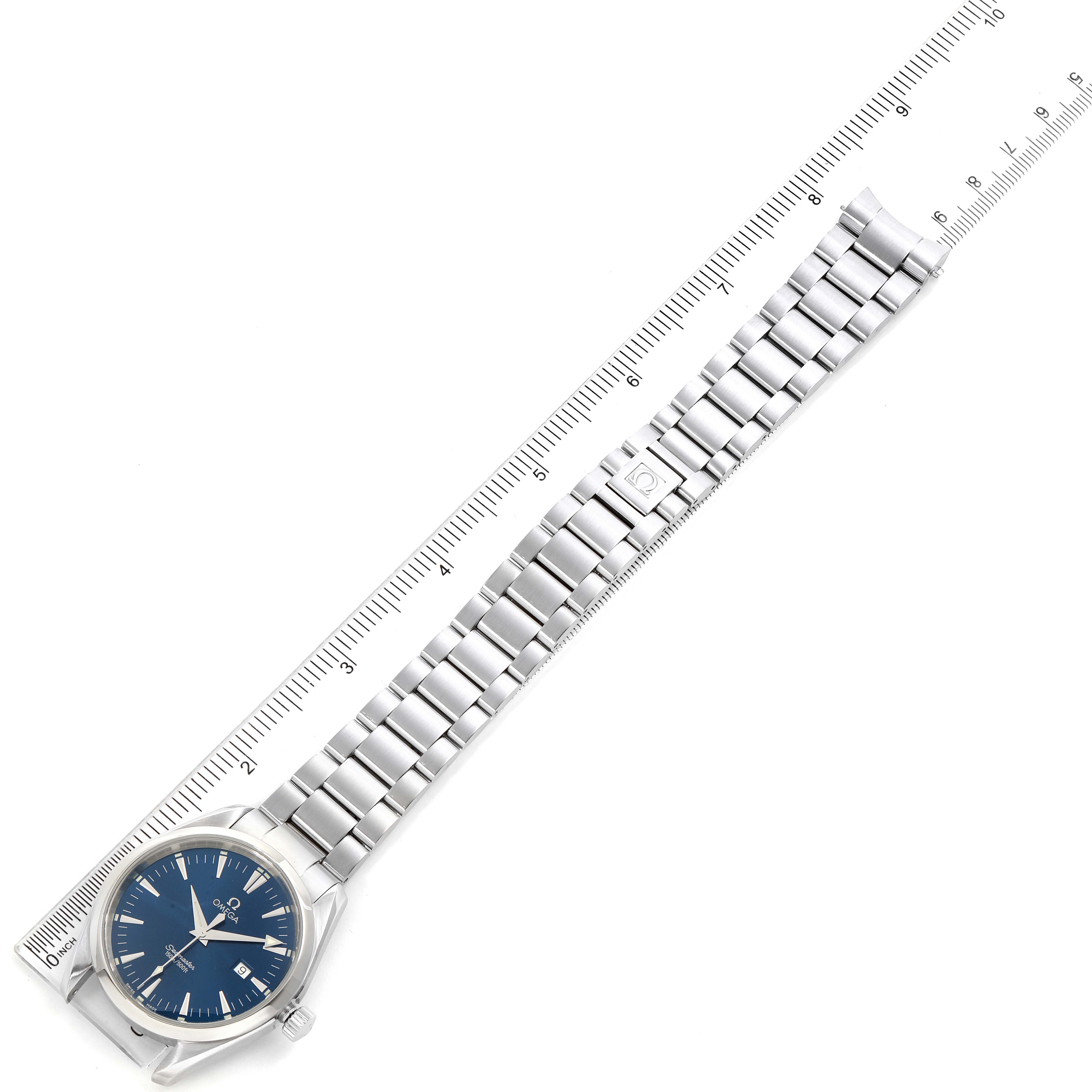 The image shows an Omega Aqua Terra 2517.80.00 Men
s Stainless Steel Blue Dial 2517.80.00 Men
s Stainless Steel Blue Dial watch laid flat with its bracelet fully extended and aligned with a ruler for measurement.