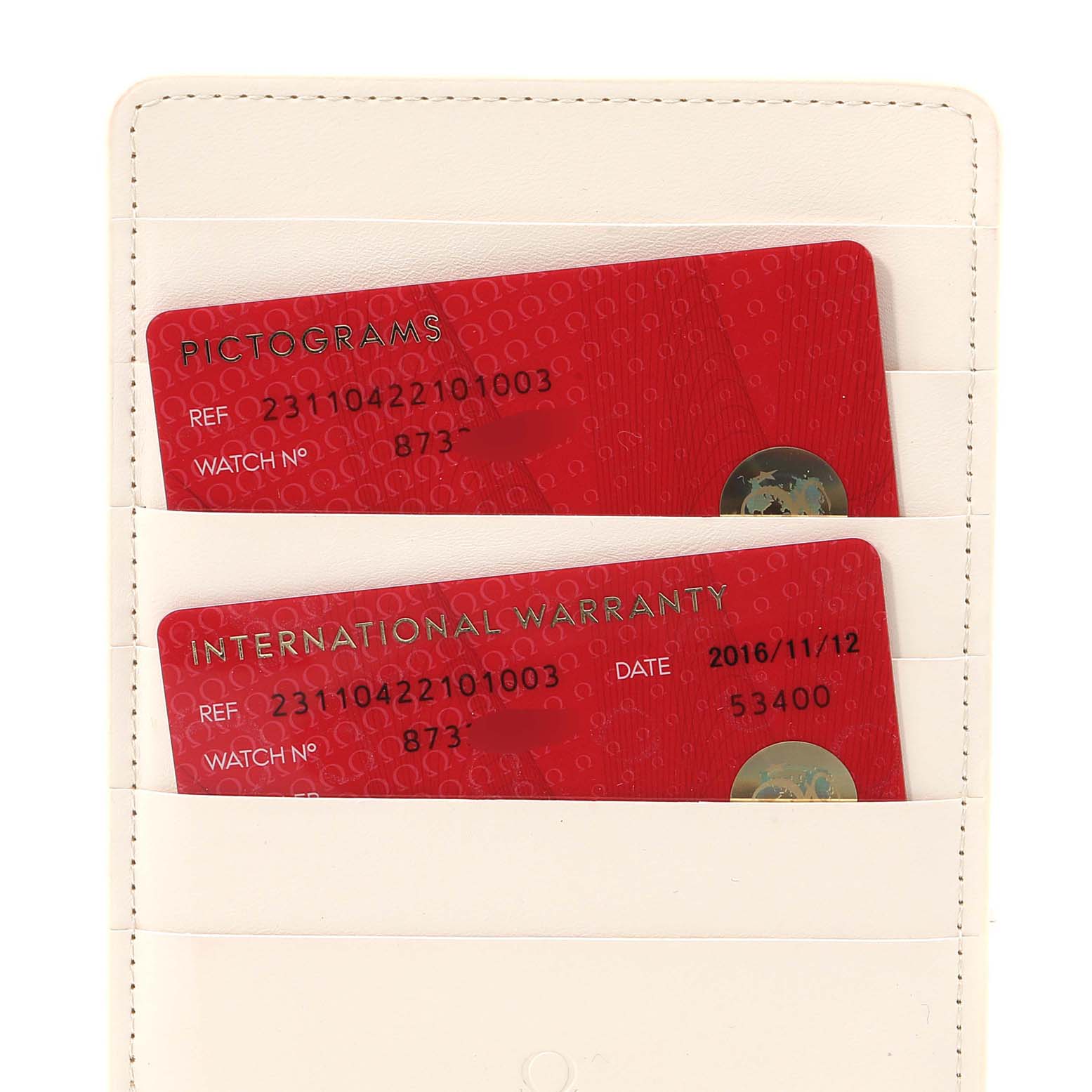 The image shows the international warranty and pictogram cards for the Omega Aqua Terra 231.10.42.21.01.003 Men's Stainless Steel Black Dial 231.10.42.21.01.003 Men's Stainless Steel Black Dial model in a white cardholder.