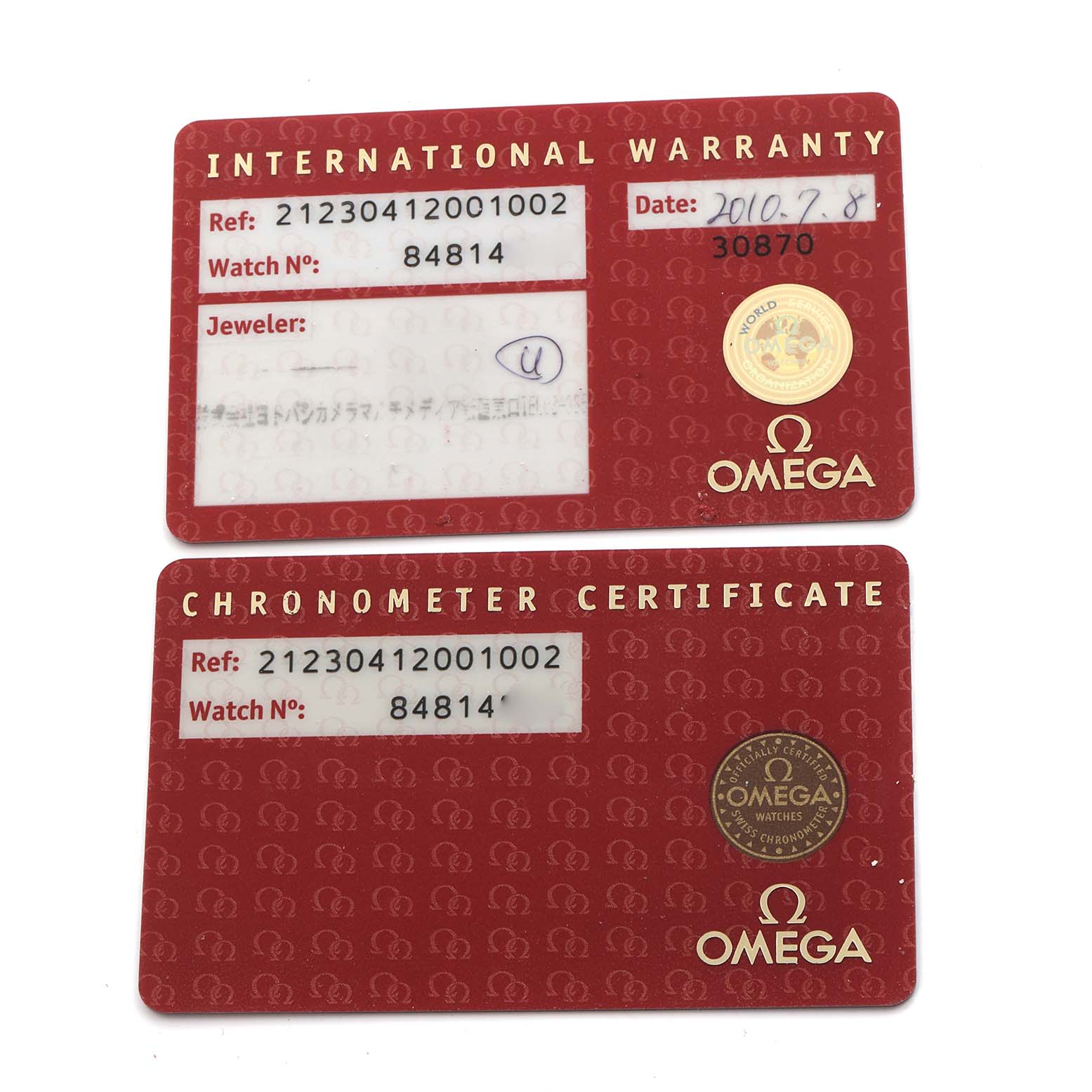 The image shows Omega Seamaster 212.30.41.20.01.002 Men
s Stainless Steel Black Dial 212.30.41.20.01.002 Men
s Stainless Steel Black Dial model warranty and chronometer certificate cards viewed from the top.