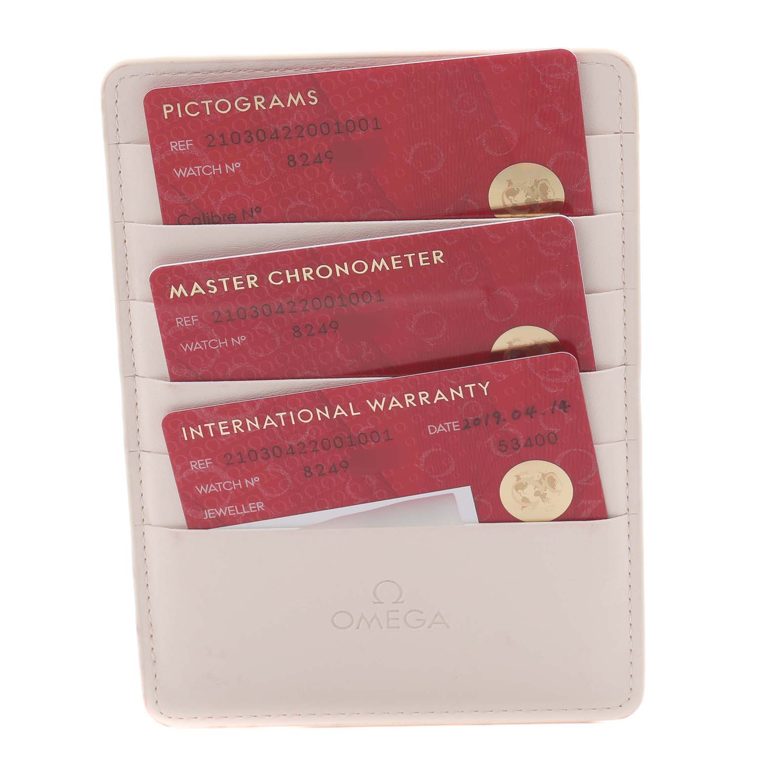 The image shows warranty and chronometer cards for the Omega Seamaster 210.30.42.20.01.001 Men
s Stainless Steel Black Dial 210.30.42.20.01.001 Men
s Stainless Steel Black Dial, positioned in a cream cardholder.