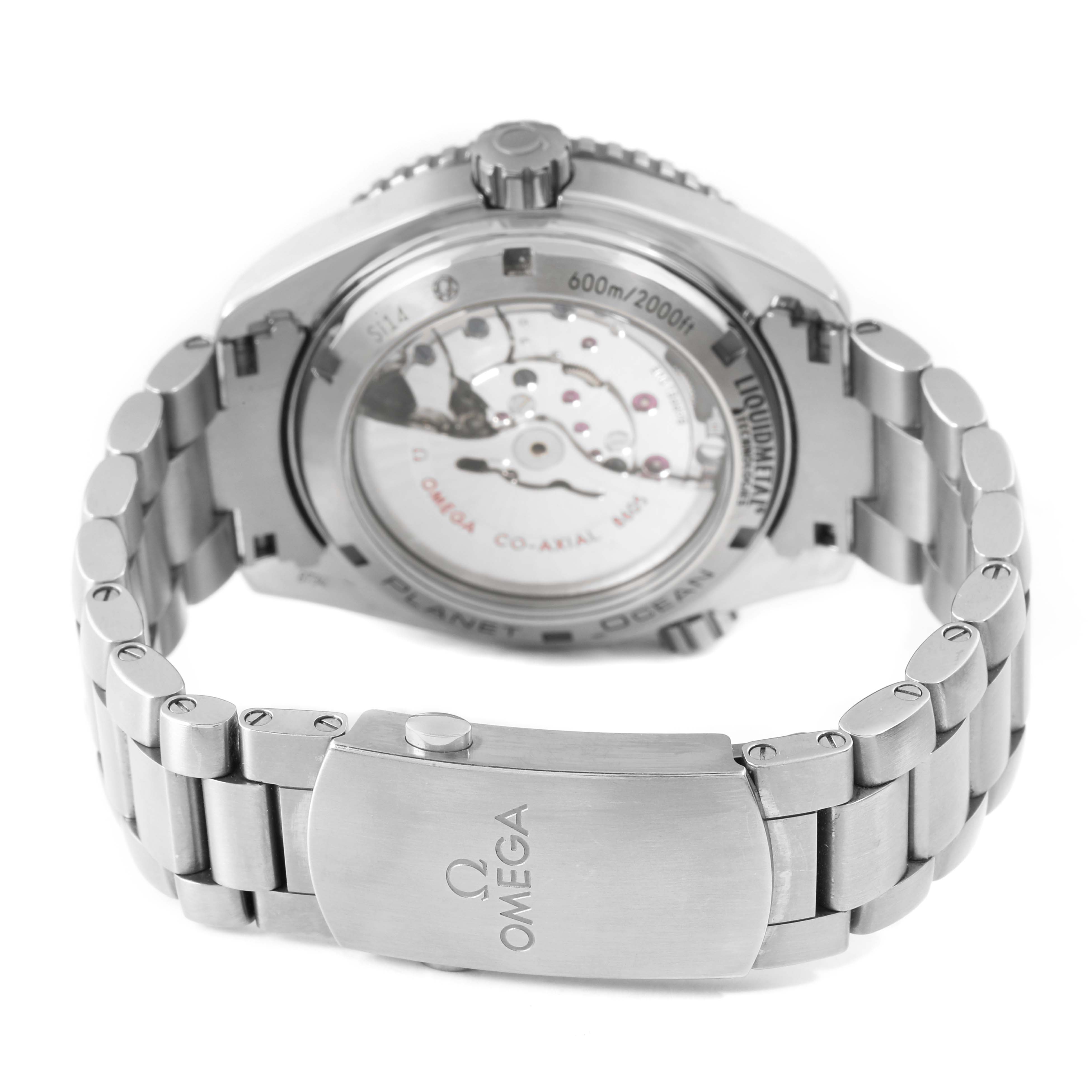 The image shows the back of the Omega Planet Ocean 232.90.44.22.03.001 Men's Stainless Steel Blue Dial watch, highlighting the transparent case back and stainless steel bracelet.