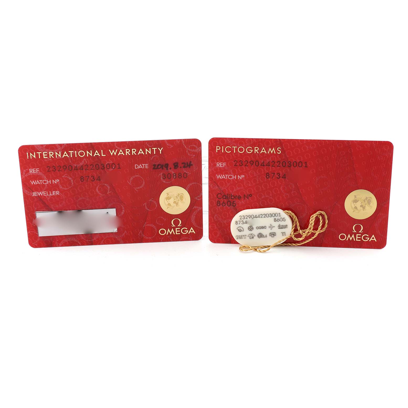 The image shows an Omega Planet Ocean 232.90.44.22.03.001 Men's Stainless Steel Blue Dial model's international warranty and pictogram cards with a hanging tag.