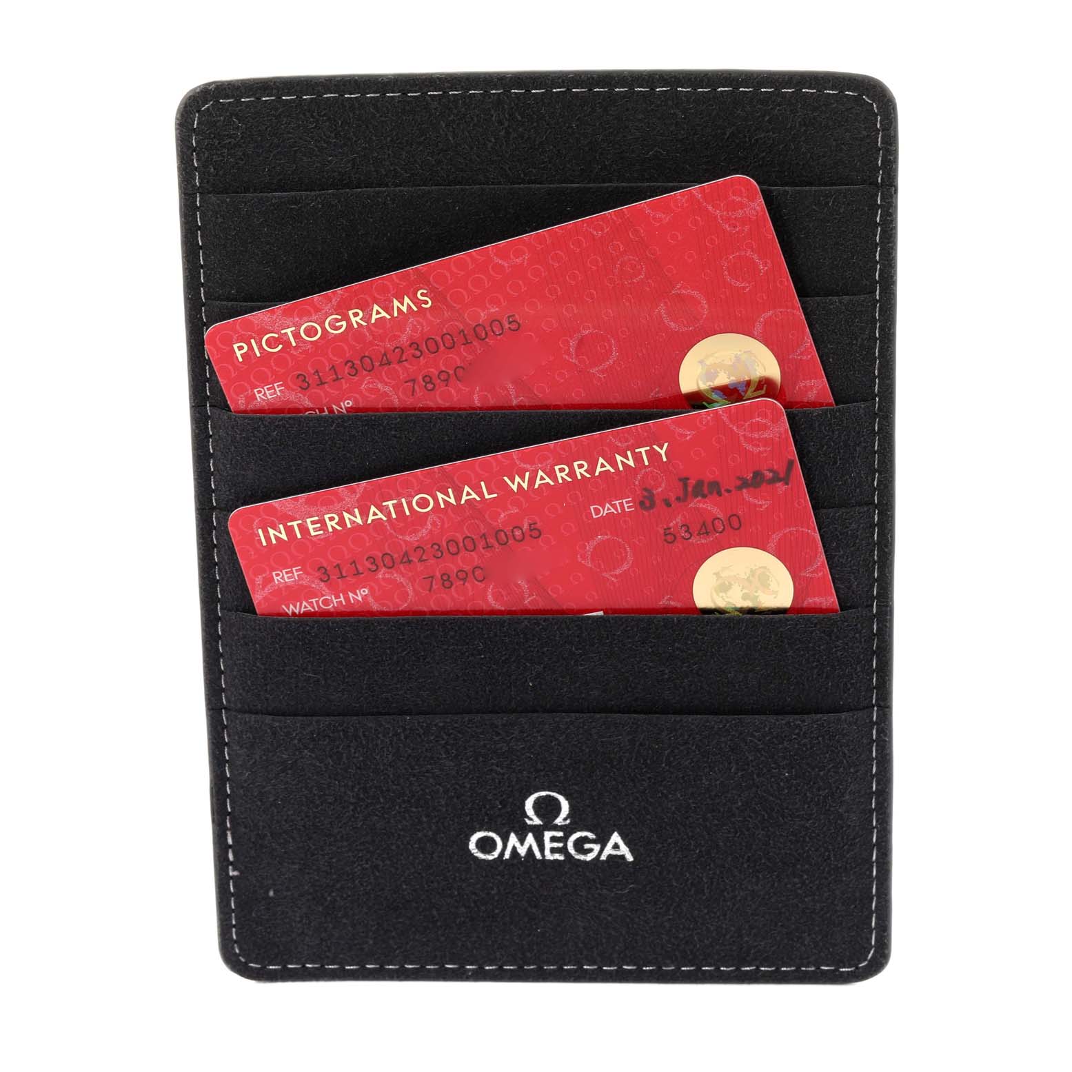 The image shows a close-up of an Omega Speedmaster 311.30.42.30.01.005 Men
s Stainless Steel Black Dial 311.30.42.30.01.005 Men
s Stainless Steel Black Dial watch accessory pouch with pictograms and international warranty cards.